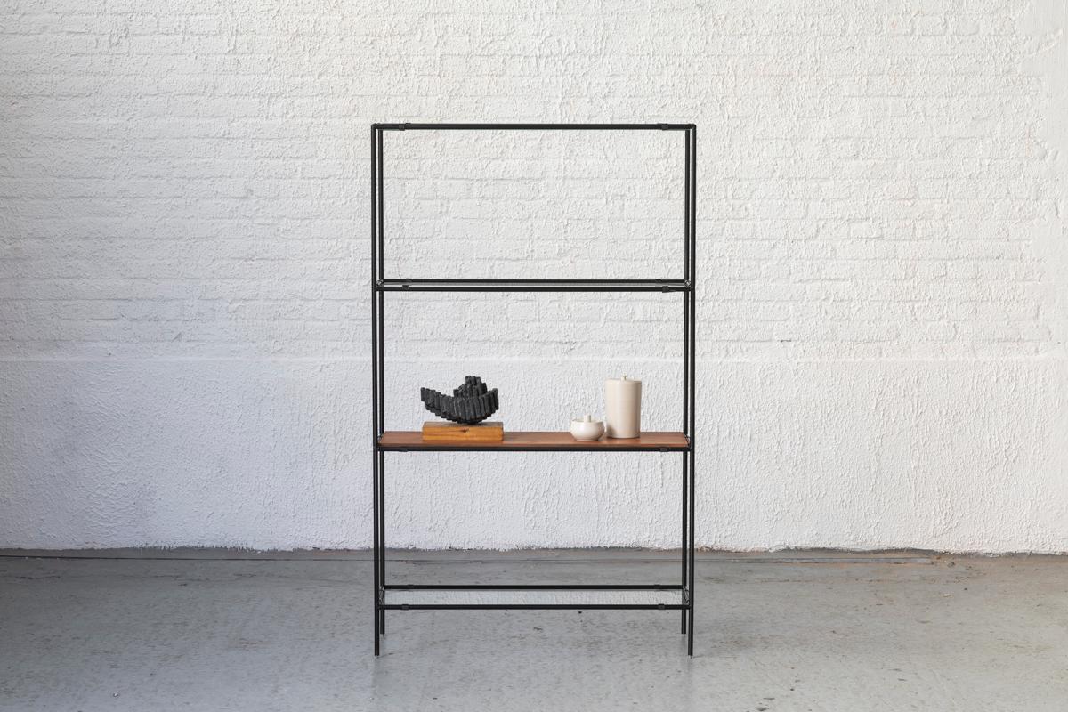 1-Piece Abstracta shelving unit designed by Poul Cadovius and produced in Denmark around 1960. This unit consist of black lacquered steel pipes, 3 glass shelves and 1 teak wood veneer shelf. In good condition with some using marks as shown in the