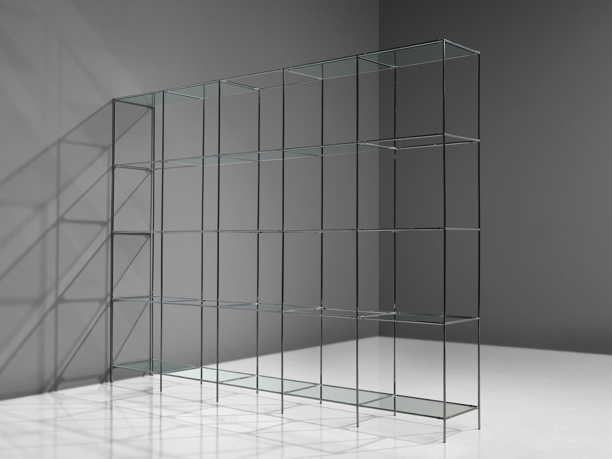 Poul Cadovius for Royal System, modular shelving unit and roomdivider, glass and chrome-plated steel, Denmark, 1960s.

This Minimalist shelving unit was designed by Poul Cadovius (1911-2011) and produced by Royal System, Denmark, circa 1960. This