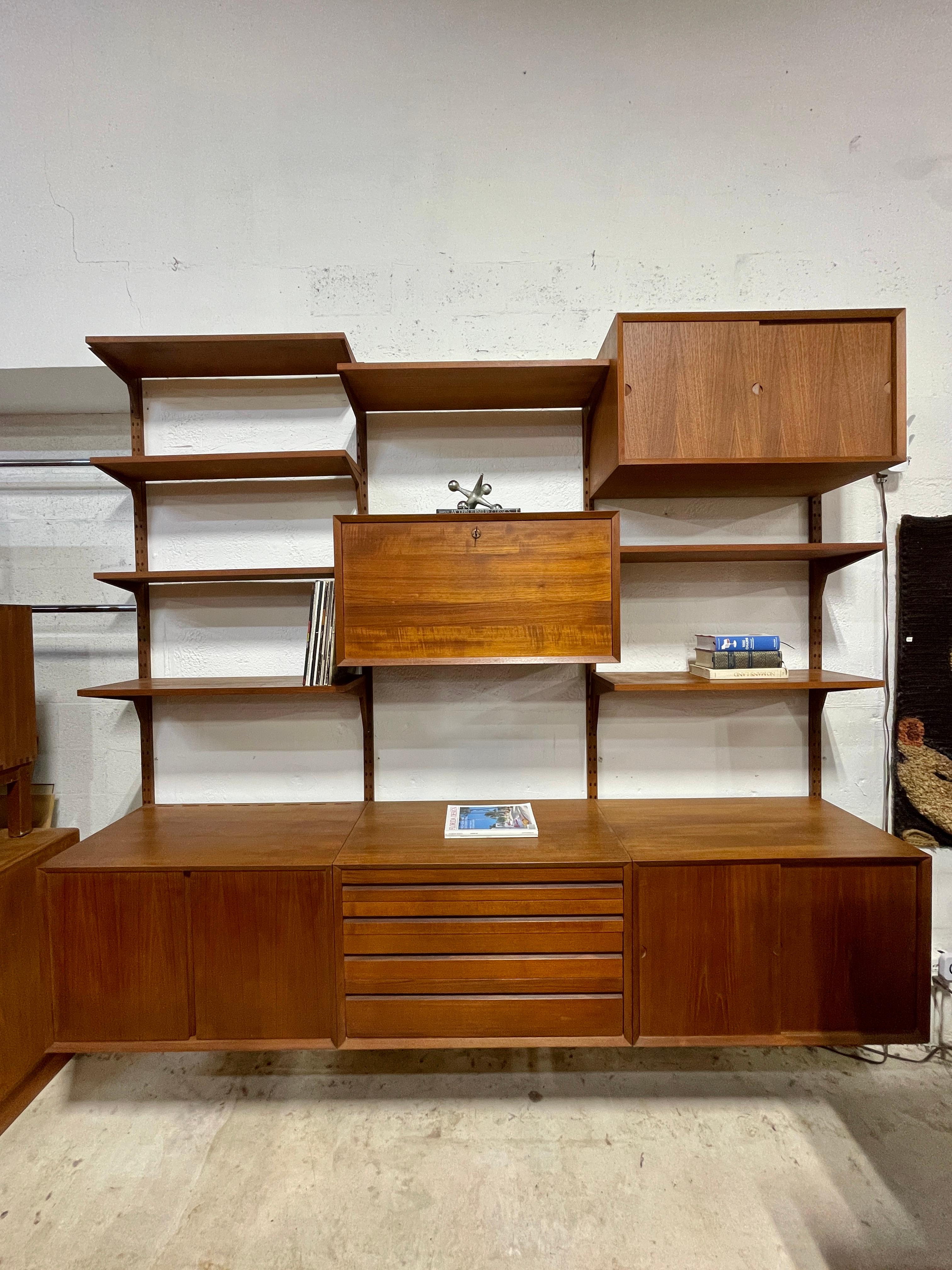 Danish Modern Poul Cadovious Wall Mounted Unit with Secretary Desk or Bar. 96.5w 80h rails