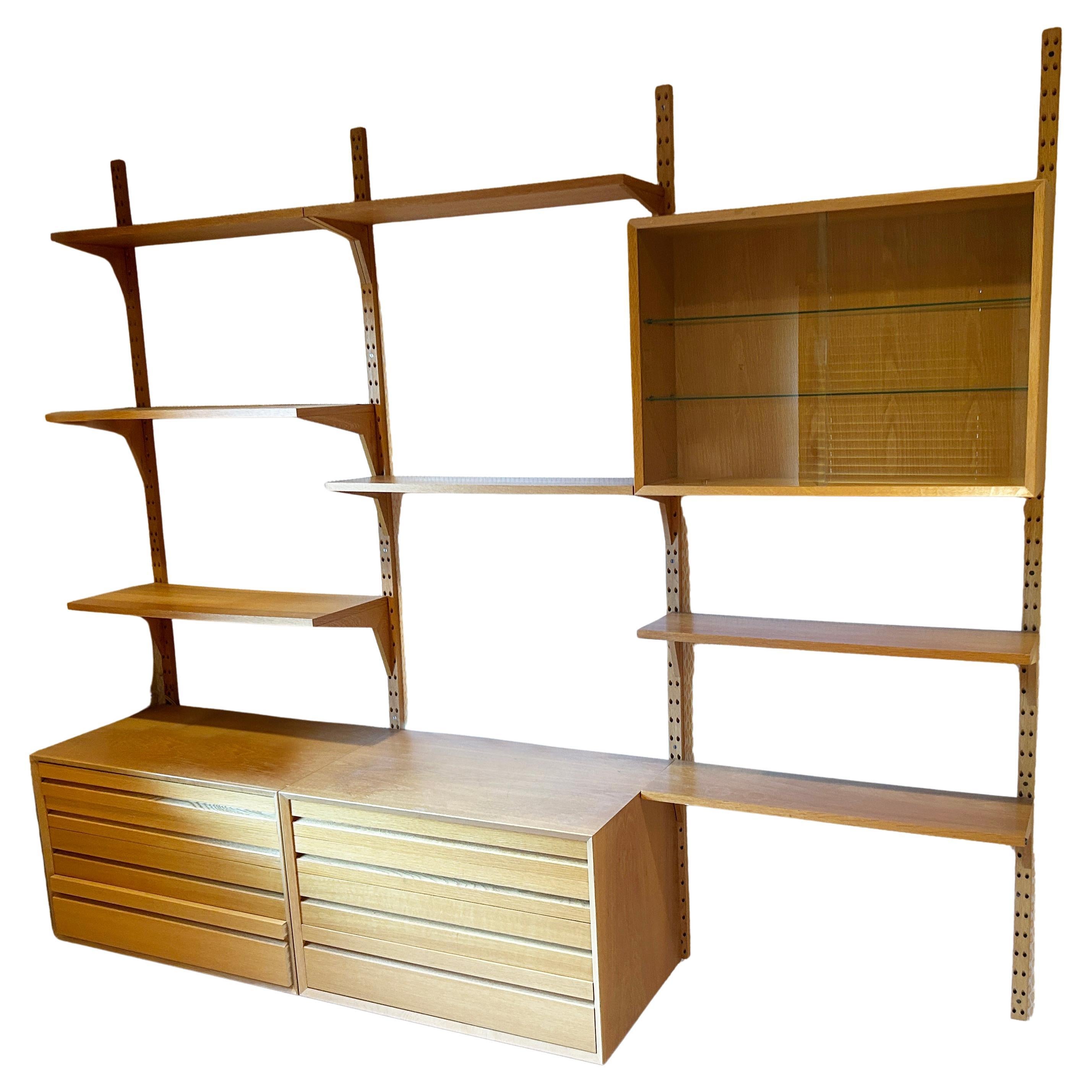 Mid Century Poul Cadovius - Cado light oak wall unit with shelves desk drawers glass cabinet. Beautiful rare light oak wood Cado wall unit great for a small room to use as desk with dressers/storage. all items have pins on back to install on