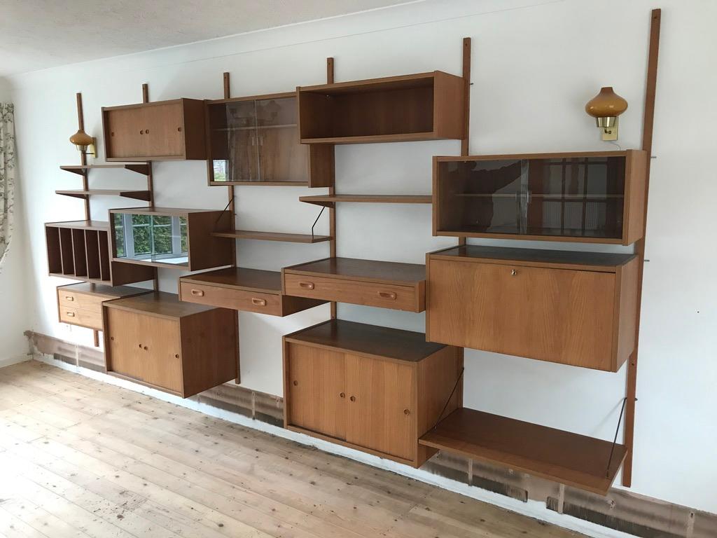 A wonderful large 5 Bay mid century Danish vintage PS wall unit in teak, this dates from the 1960s. The condition is excellent for its age, little wear to be seen, the teak has a stunning colour and beautiful grain patterns throughout. The units and