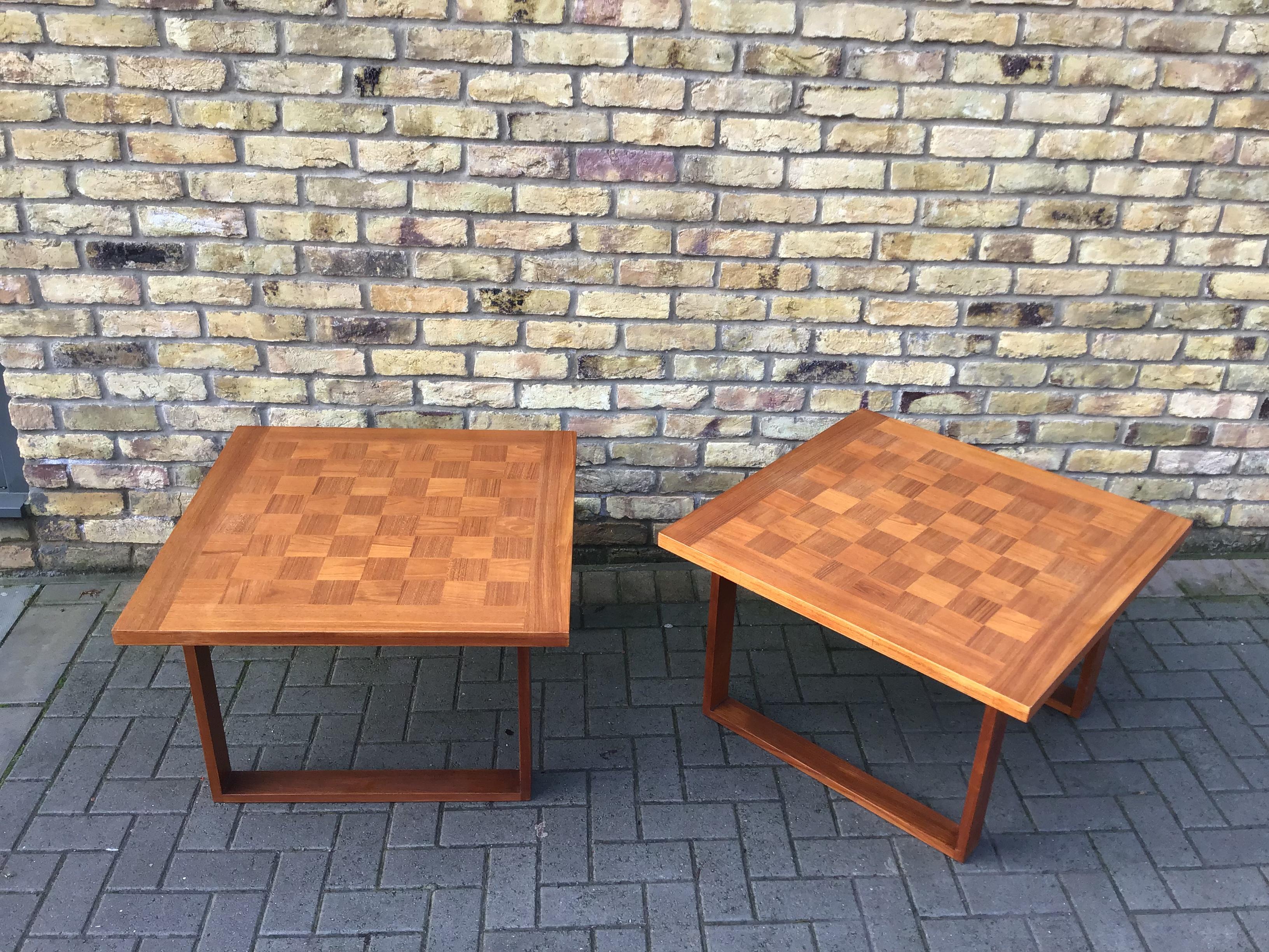 Beautiful pair of side tables with a playing surface in rosewood and teak inlay. Simple flexible design circa 1960s by Poul Cadovius 
for France & Son.
 