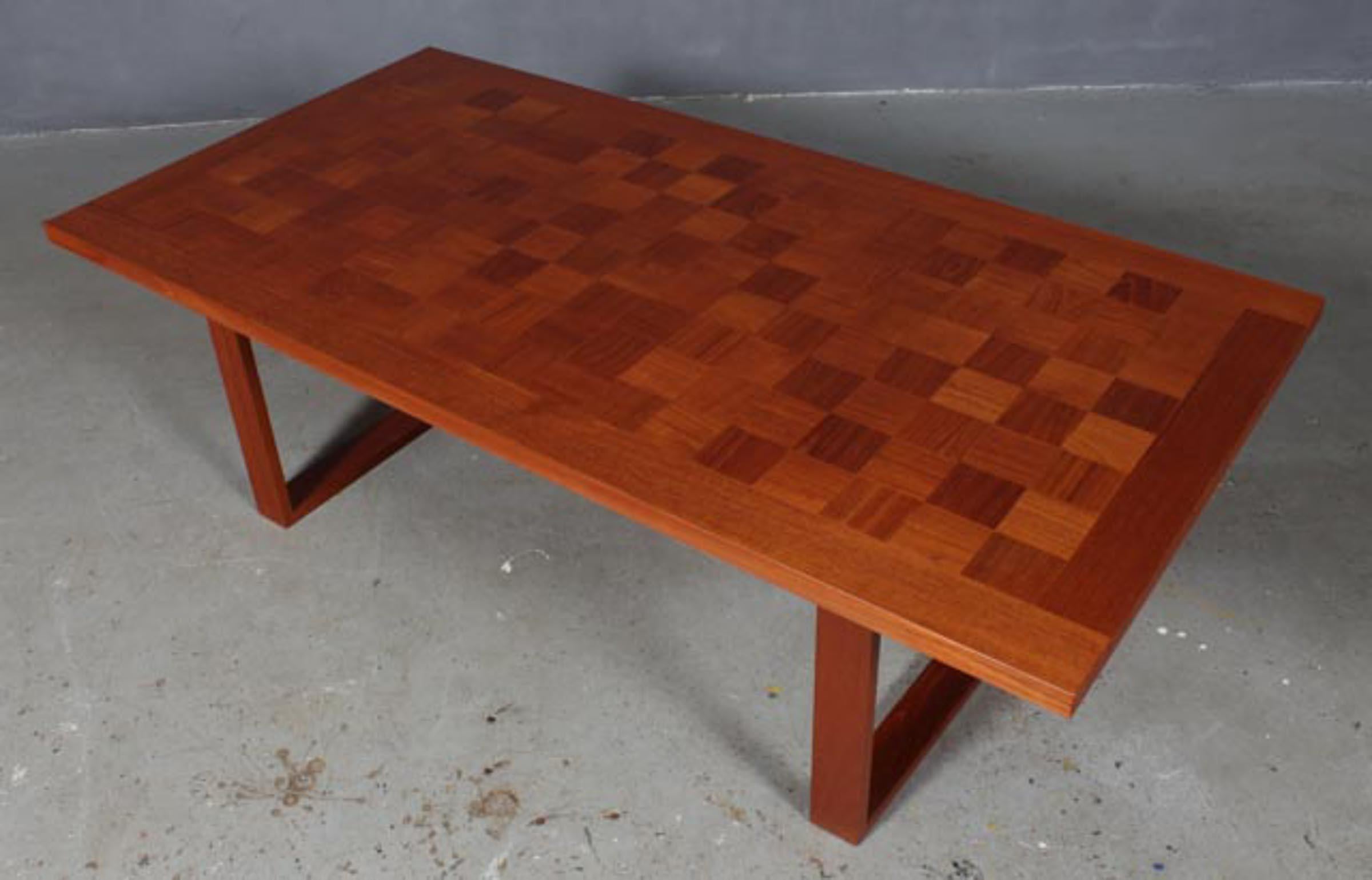 Poul Cadovius coffee table in partly solid teak, chess pattern.

Made by France & Son.