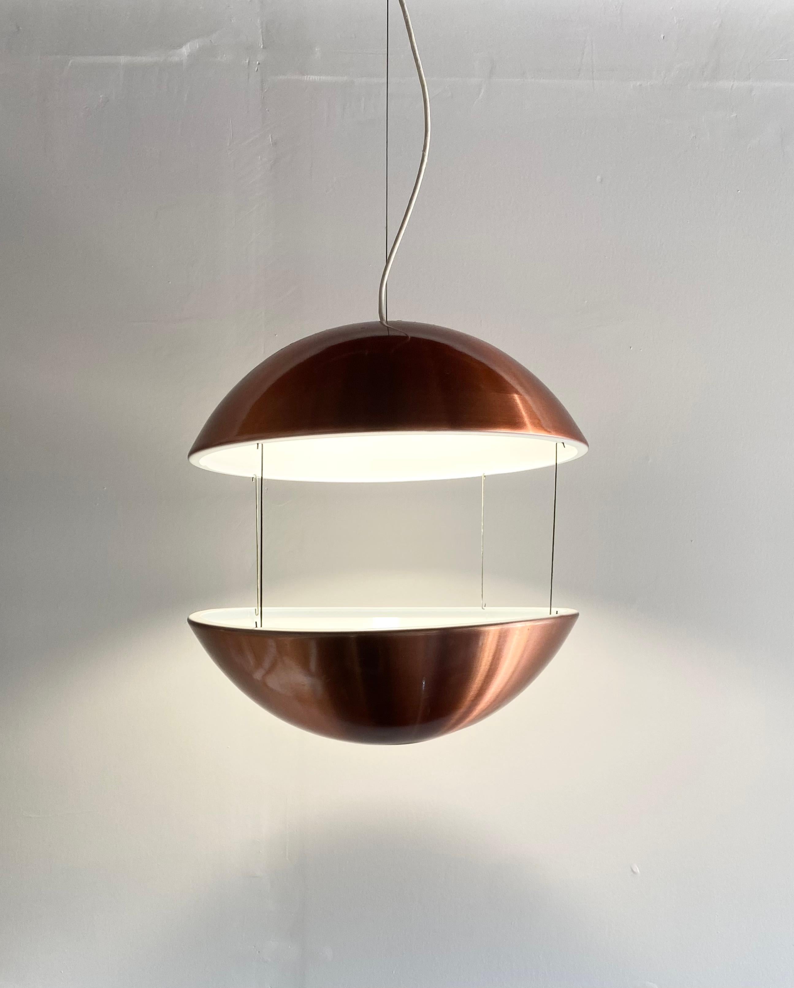 Flower lamp RS 50 designed by Poul Cadovius in 1968 and produced by LB Lyskaer Belysning, label is intact. Brushed copper finish with white enamel interior. 

Two aluminum half domes connected with four connectors, form a broken up sphere. The