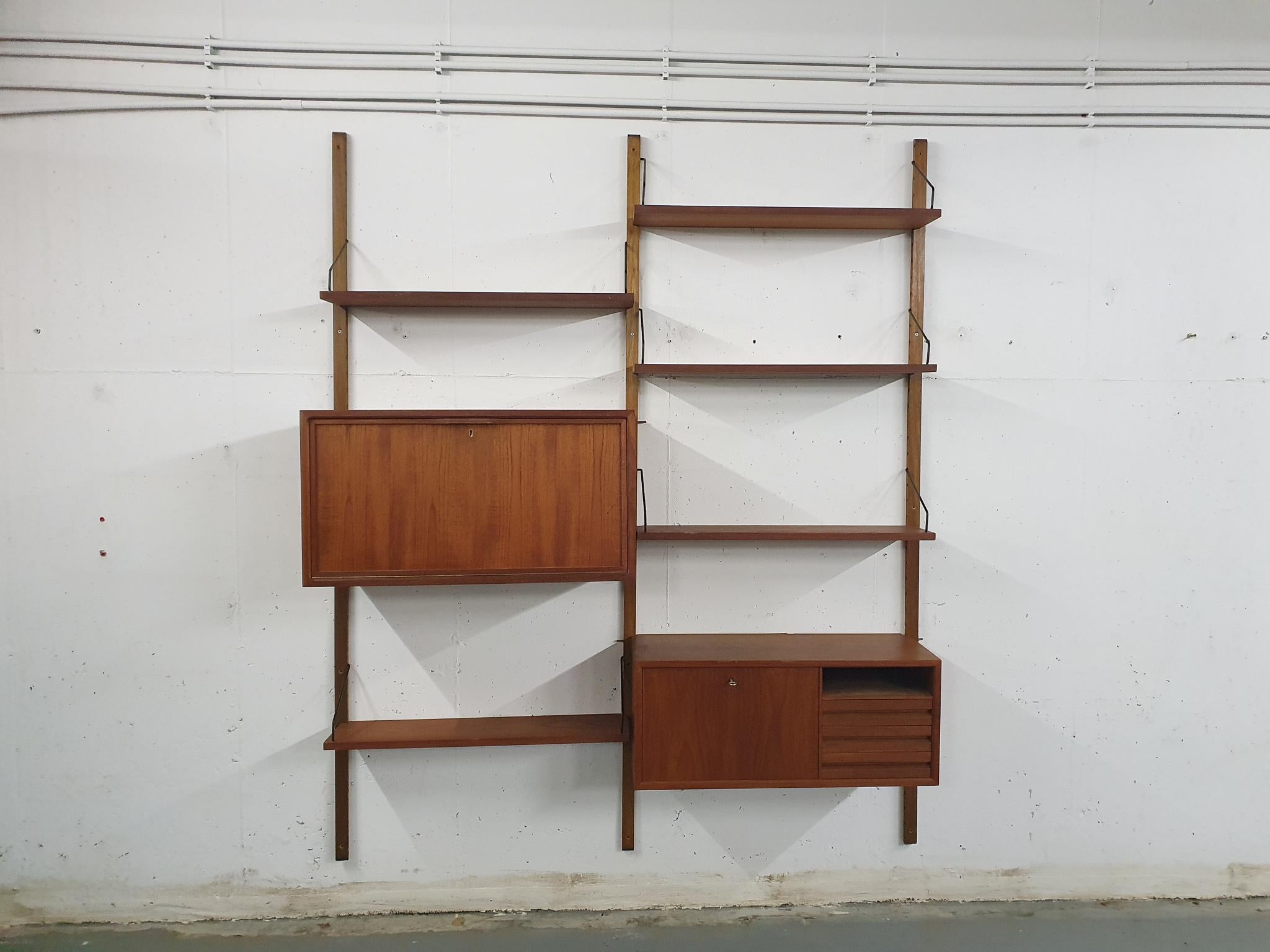 Wooden risers and teak veneer book shelves and cabinet with black metal hooks.

This wall unit consist of:
5 x shelf: 80 x 20 cm
1 x cabinet: 80 x 30 x 34cm (LxDxH)
1 x cabinet: 80 x 37.5 x 43cm (LxDxH)
3 x risers: 200 cm
