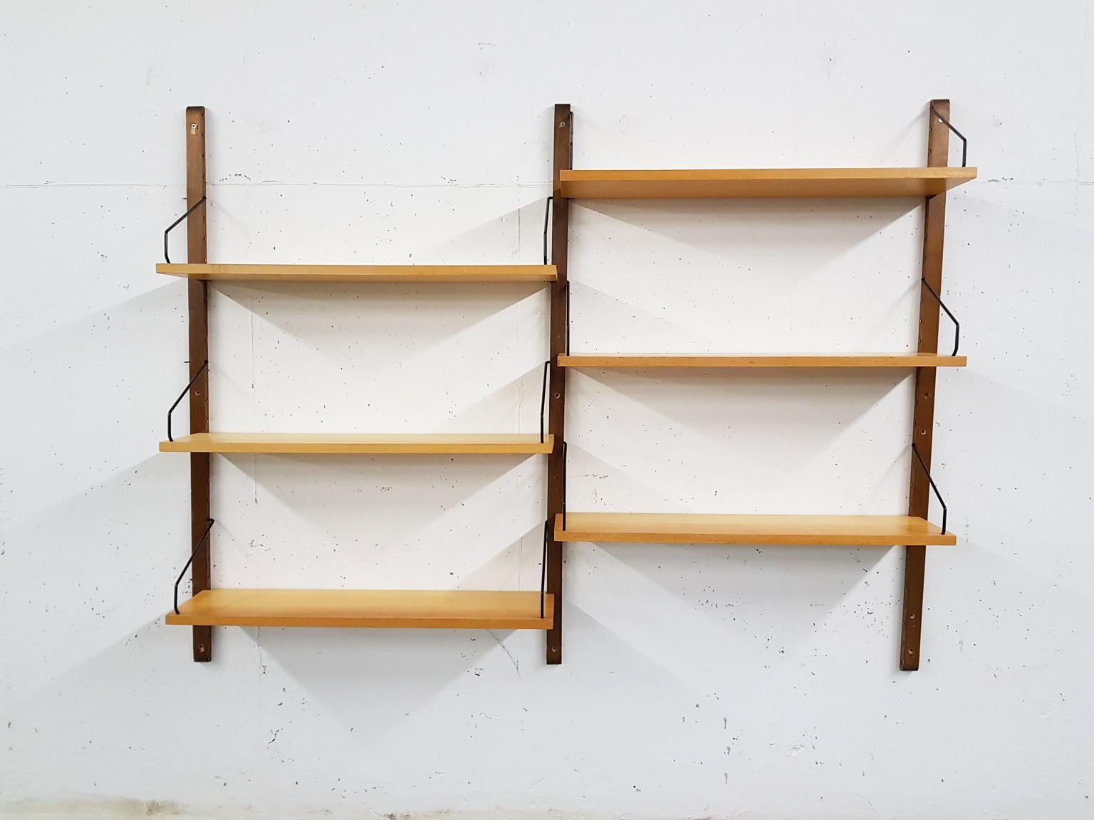 Danish design wall system or shelving unit by Poul Cadovius for Royal System in rare elmwood, designed in Denmark in 1948.

When you ask someone to think of an European midcentury wall unit, most will probably think of Poul Cadovius and his