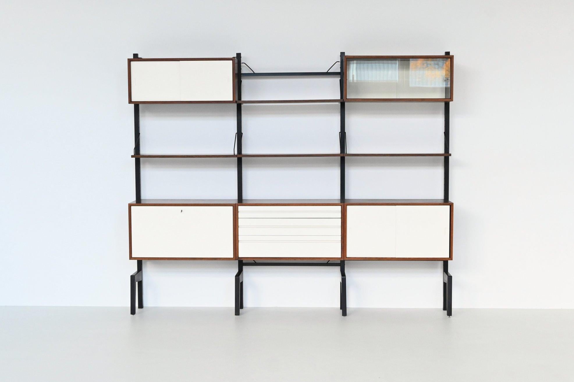 Beautiful large wall unit designed by Poul Cadovius for Royal System, Denmark 1960. This highly versatile and functional wall system offers a variety of storage and display options. This piece is crafted from richly grained rosewood in combination