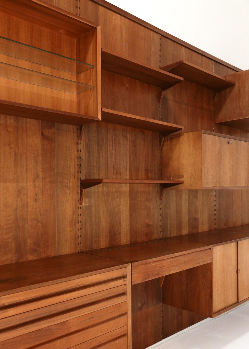 Wall mounted bookcase from 1960s designed by Poul Cadovius.
The modular bookcase system includes 5 storage cabinets 4 shelves and one desk.
           