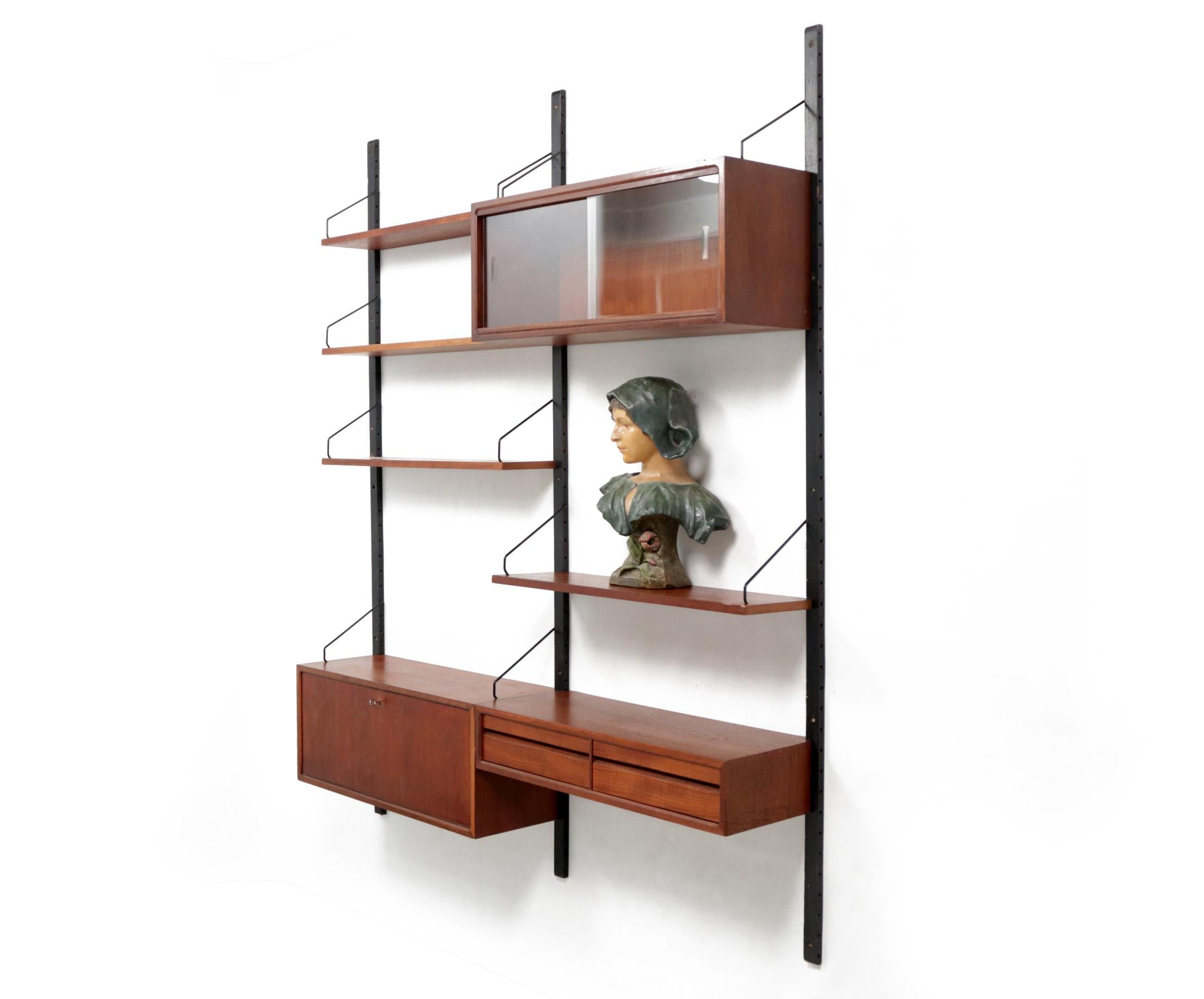 Beautiful modular floating shelving system, by Poul Cadovius for Royal System.

Display cabinet 80 x 30 x 33.5 cm
Chest of drawers 80 x 30 x 15.5 cm
Cabinet 80 x 30 x 33.5 cm
1 shelves 80 x 24.5 cm
3 shelves 80 x 20 cm.
