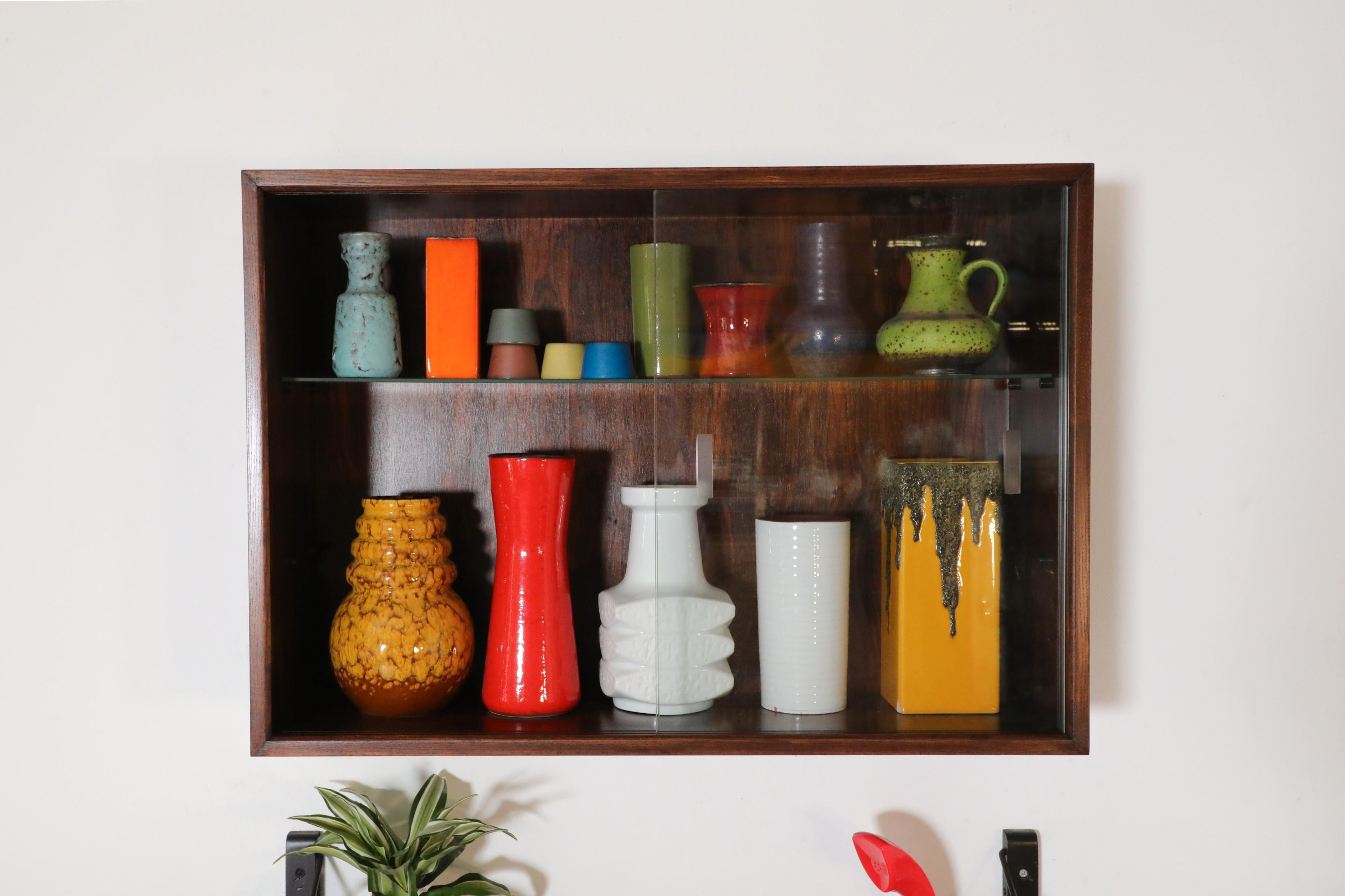 Mid-Century Modern Poul Cadovius Royal Rosewood Wall Mount Sliding Glass Front Cabinet and Shelving For Sale