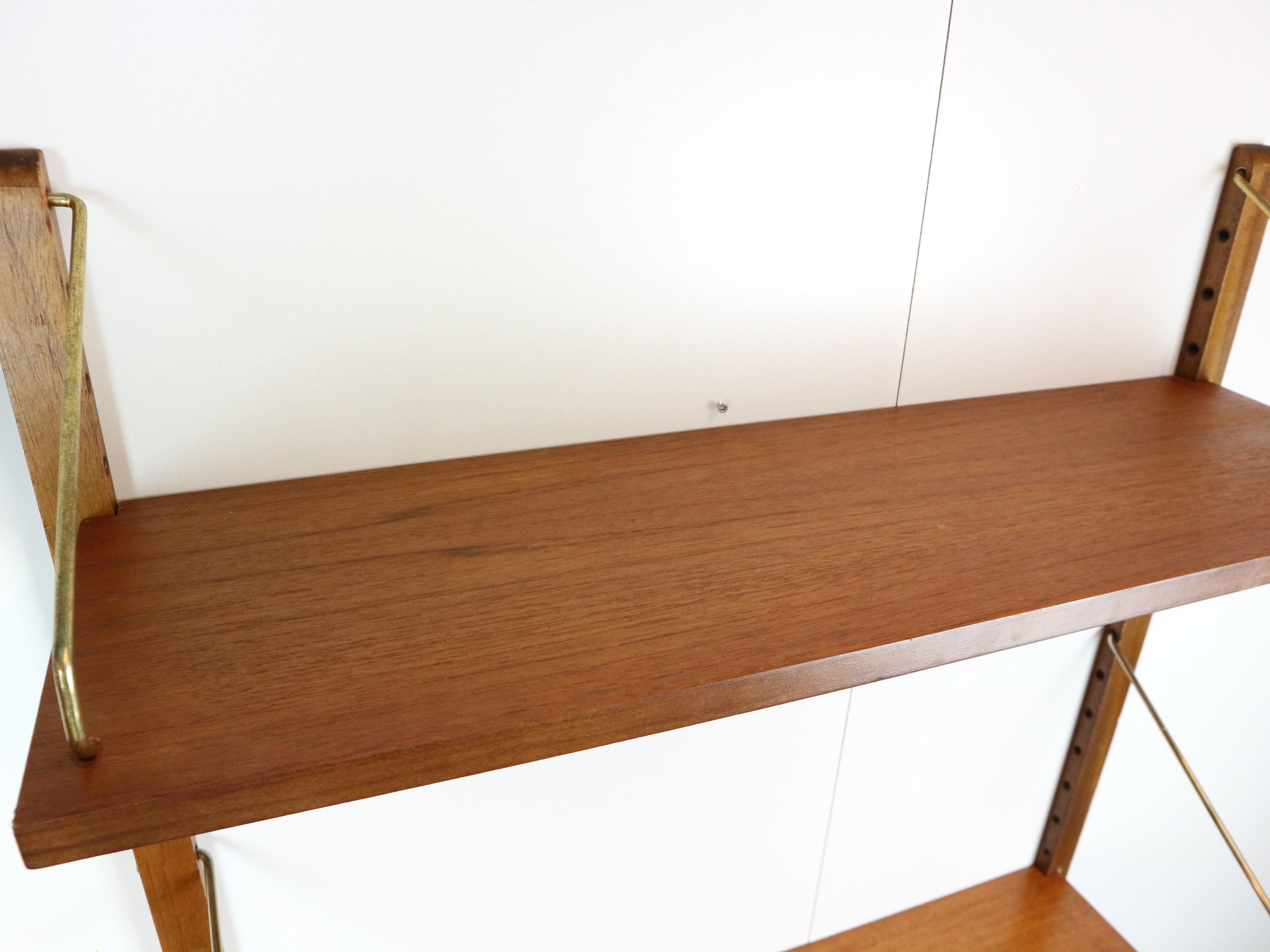 Brass Poul Cadovius 'Royal System' teak desk shelf and brass brackets, 1960s Denmark
