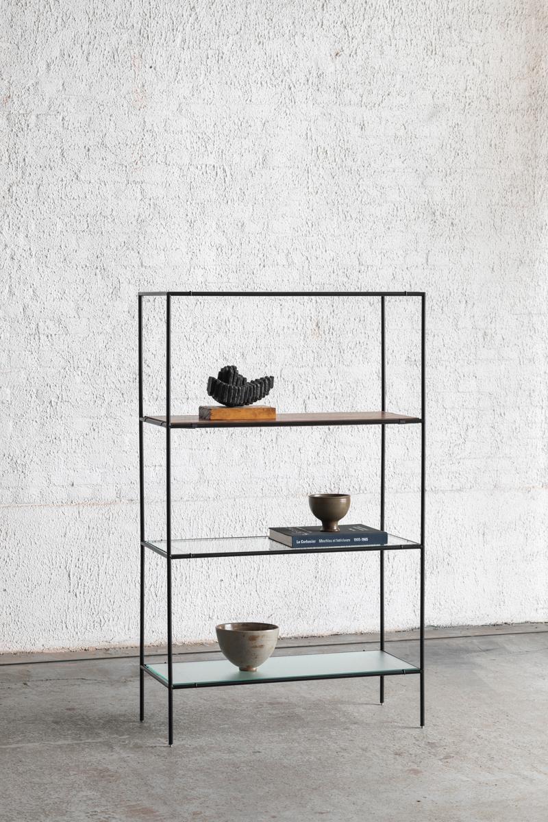 Abstracta shelving unit designed by Poul Cadovius and produced in Denmark around 1960. Frame in black lacquered steel pipes and shelves in teak veneer, figured glass and normal glass. The shelves can be arranged as desired. In good condition with
