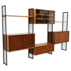 Poul Cadovius Style Mixed Wood Wall Unit with Black Enameled Metal Grid Risers