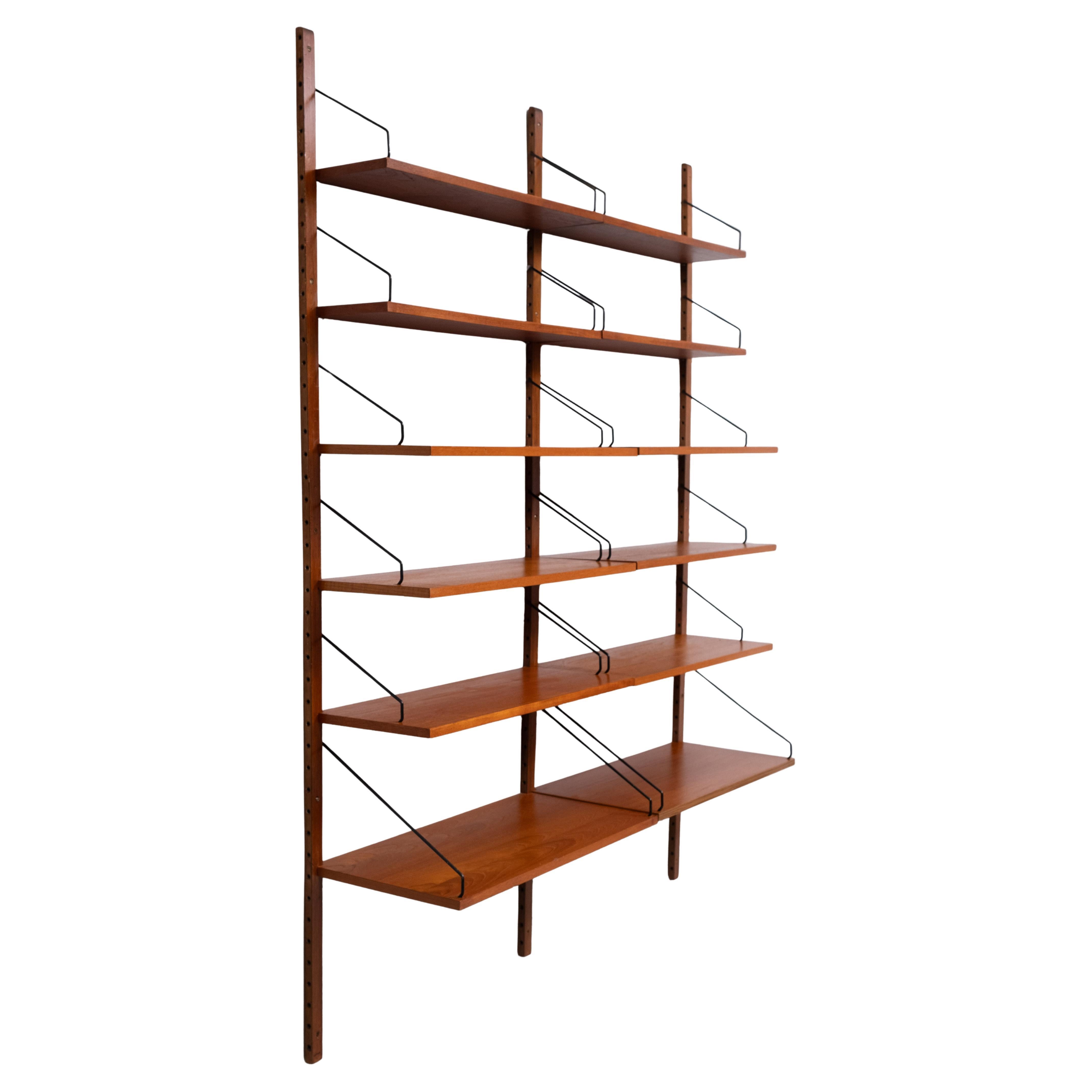 Iconic Poul Cadovius for Royal System . Denmark 1960s                     Bookcase . The perfect solution , for your storage problems 
Takes not muts space ,and can holt a lot . Rare extra Depth on the shelves
3 uprights ,comes with 12 shelves ,in 3