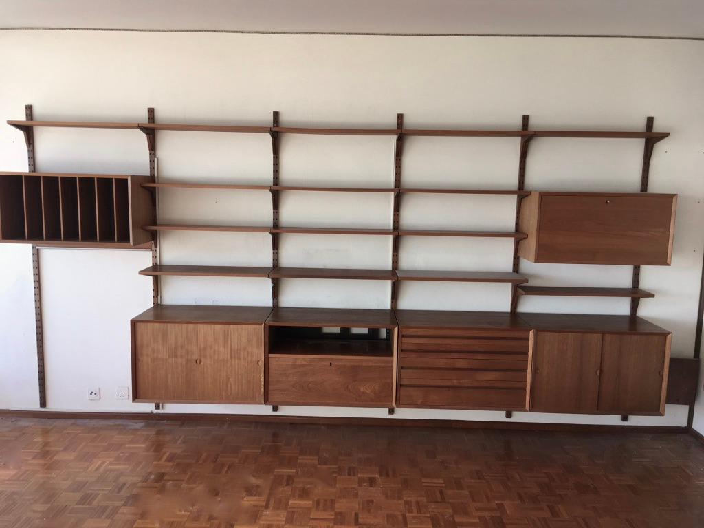 Teak modular wall unit by Poul Cadovius produced by Cado Denmark circa 1960s
- 2 sliding doors cabinets
- 1 drawers cabinet
- 1 discs cabinet
- 1 hifi cabinet
- 1 secretaire cabinet
- 1 desk 
- 15 shelves
- matching keys
- 6 poles

The