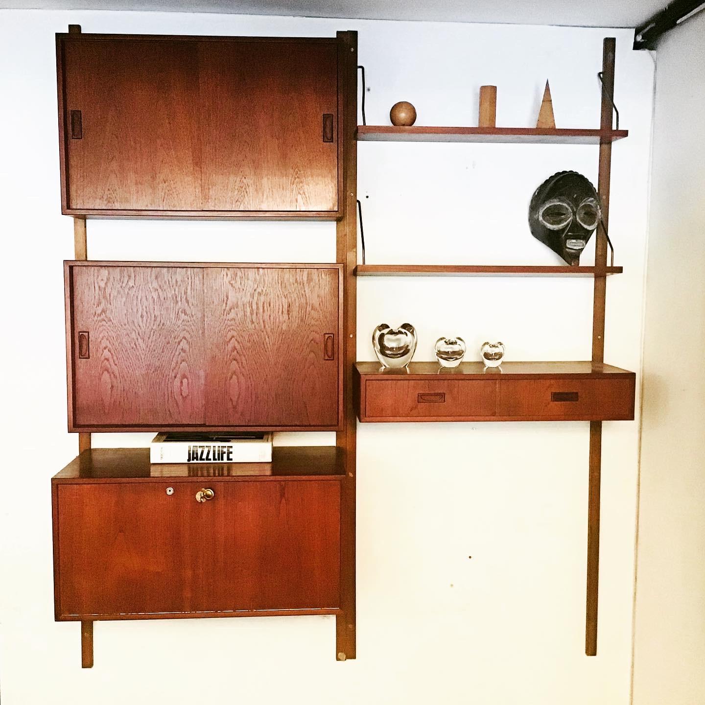A beautiful flexible hanging wall unit it consists of three cabinets and one set of draws and two adjustable shelves. The cabinets and shelves are interchangeable
So can be configured in a number of ways,
circa 1960s Danish by Poul Cadovius.
 