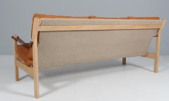 Sofá de tres plazas Poul Cadovius de fresno, piel anilina, lona y piel de silla de montar