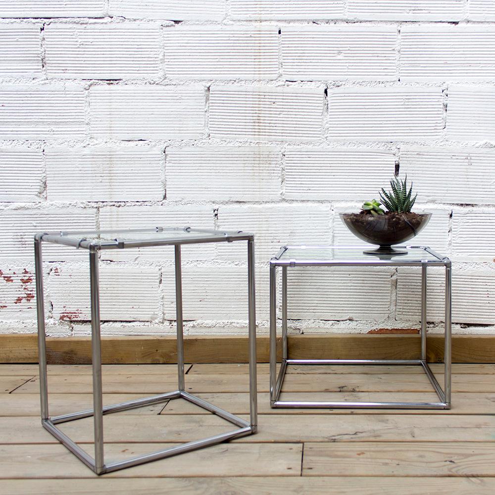 Designed by Poul Cadovius for Abstracta System, glass and chrome steel structure, 1960s.. 

This geometric cube side table was designed by Poul Cadovius for his furniture manufacturing company, Abstracta System. The midcentury Industrial style
