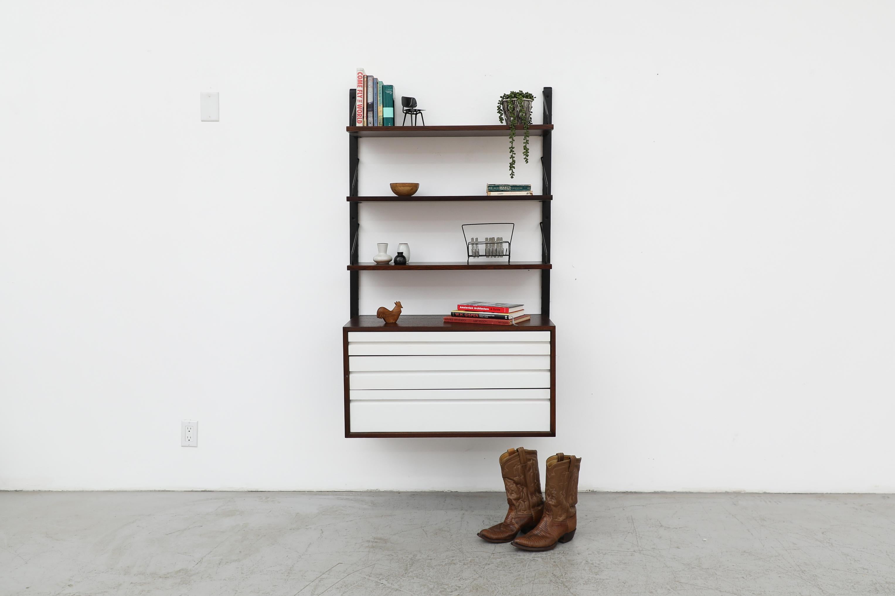 Mid-Century, Poul Cadovius designed, wall mounted shelving unit from the famed and ground breaking line of 