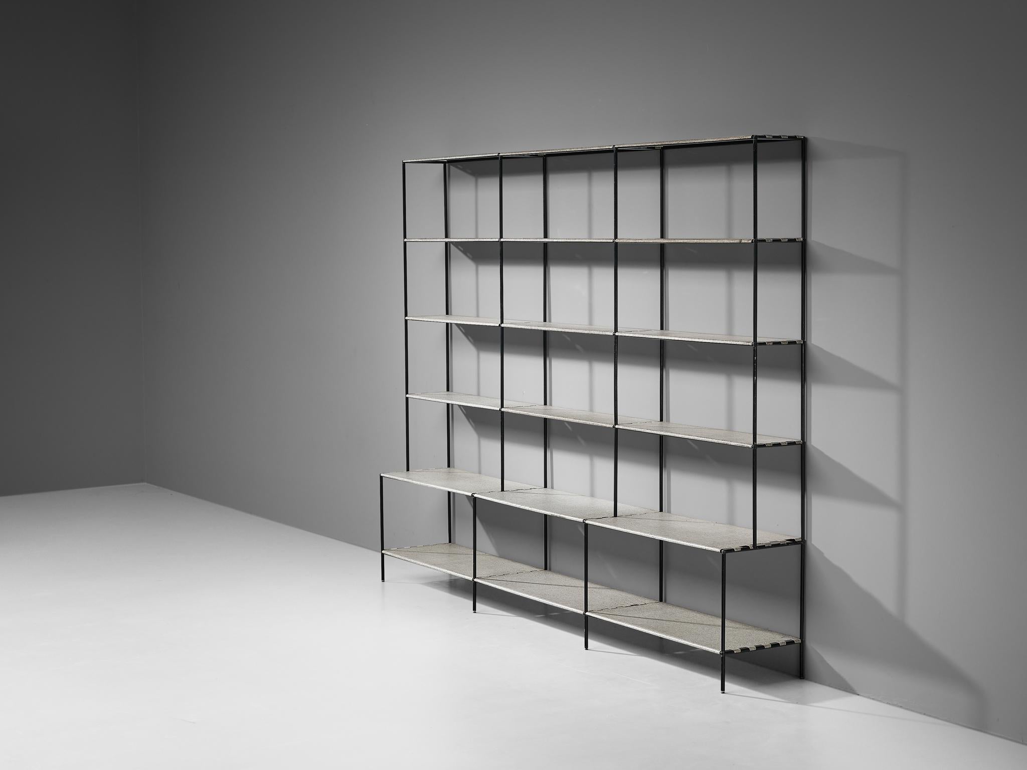 Poul Cadovius, open bookshelf or room divider, metal, Denmark, 1960s

This sizable and minimalist shelving unit was designed by Poul Cadovius. This shelving system exists of a thin frame in black metal to which shelves can be attached. Three open