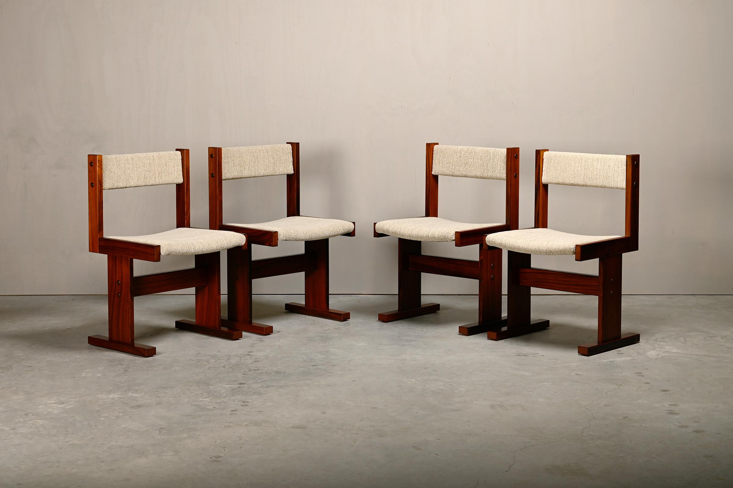 Beautiful set of 4 or 8 Scandinavian modern dining room chairs designed by Poul H. Poulsen for Gangsø Møbler, Denmark, 1970s. Simple and distinctly modernist style with cool geometric profile design. Rosewood veneer frame with upholstered seat and
