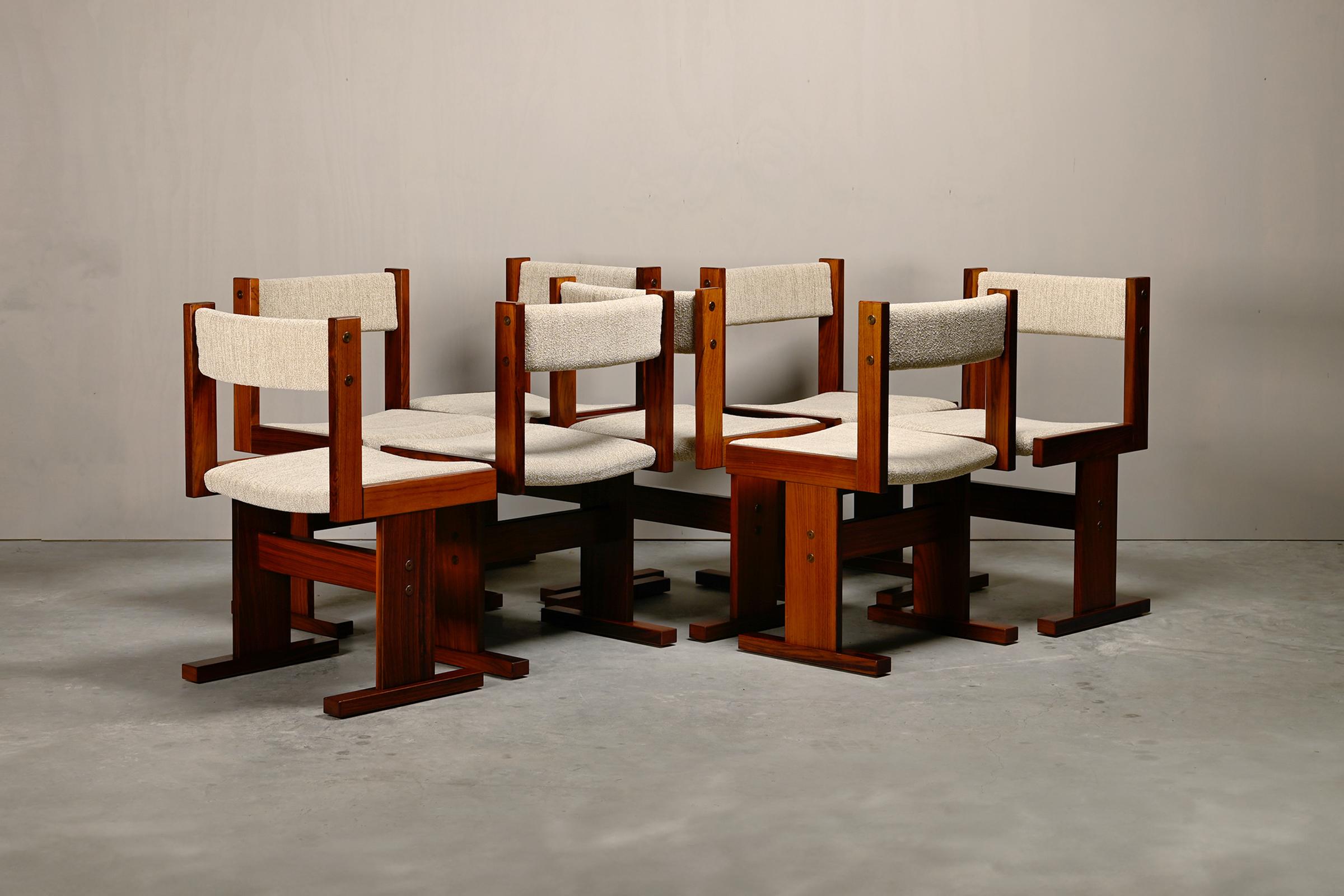 Beautiful set of 8 Scandinavian modern dining room chairs designed by Poul H. Poulsen for Gangsø Møbler, Denmark, 1970s. Simple and distinctly modernist style with cool geometric profile design. Rosewood veneer frame with upholstered seat and
