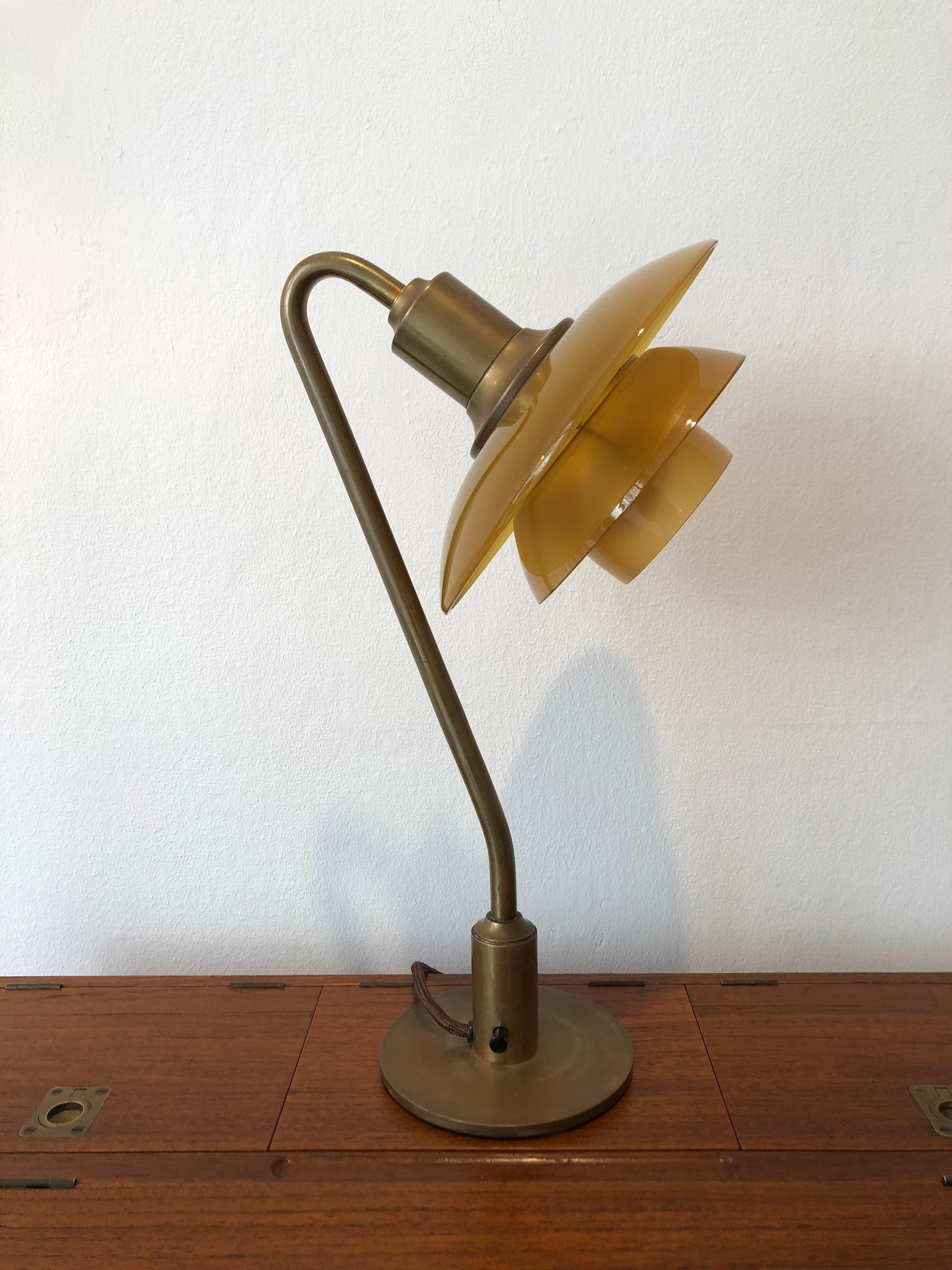 Poul Henningsen, 'Snowdrop' desk lamp, model 2/2 in brass with amber colored glass shades. This model manufactured 1931–1933 by Louis Poulsen, Denmark. Stamped 'PH2 PATENTED'.

Literature:
“Light Years Ahead”, ill. p. 164.