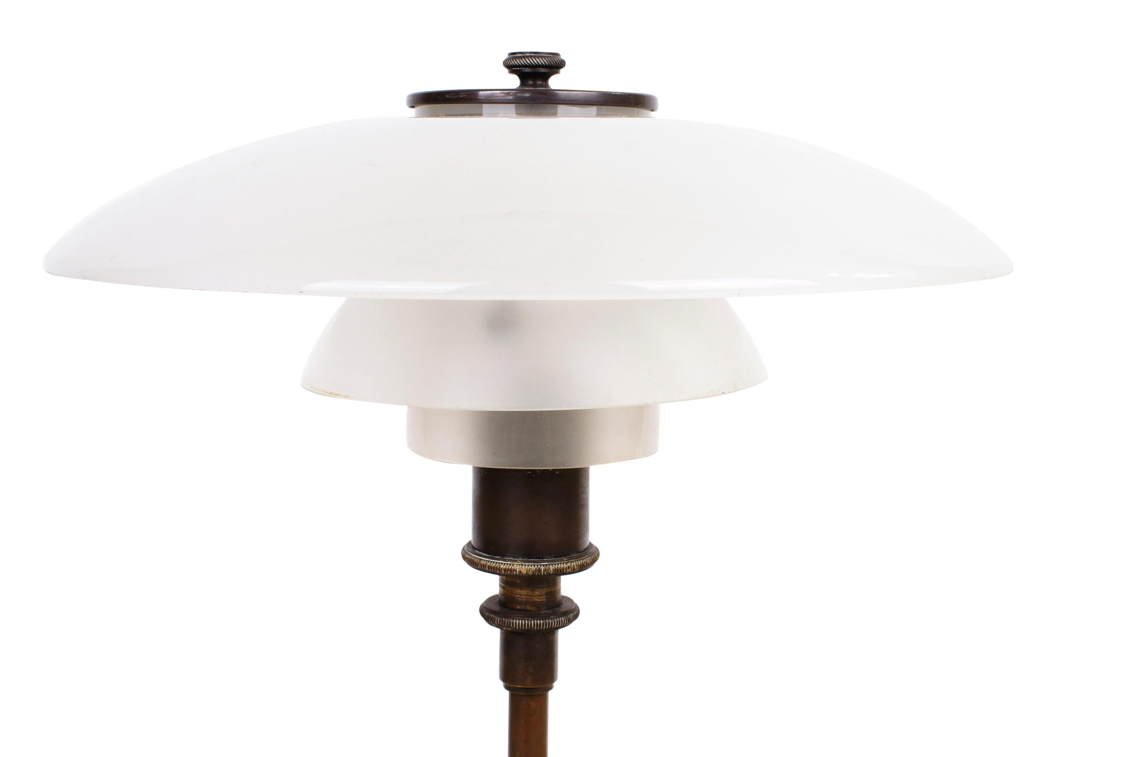 Poul Henningsen 3/2 desk lamp with base in brown brass and shades in original opaque glass. Top of base is stamped 