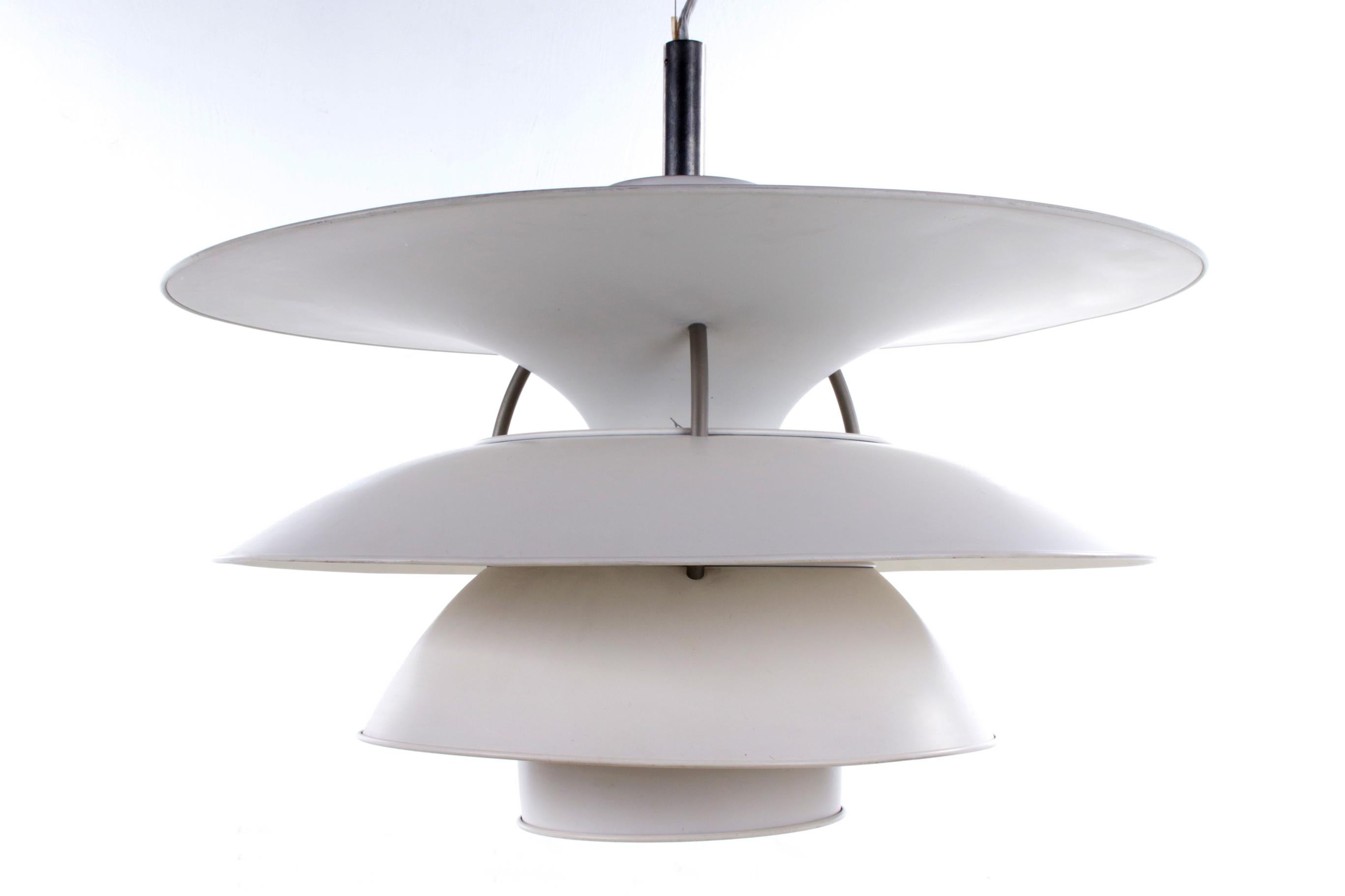 The Charlottenborg pendant lamp (Model PH 6-6.5) is a classic piece of famous Danish design. Designed by Poul Henningsen for the Danish company Louis Poulsen around the 1960s.

The lamp consists of four large white lampshades made of white