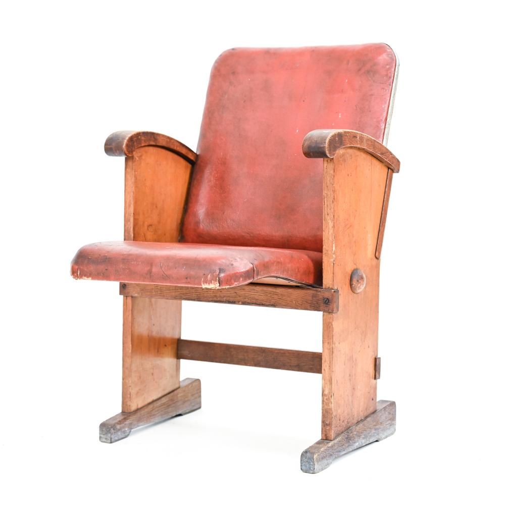 A rare Danish mid-century cinema chair designed by Poul Henningsen in beech wood with faux leather upholstery.