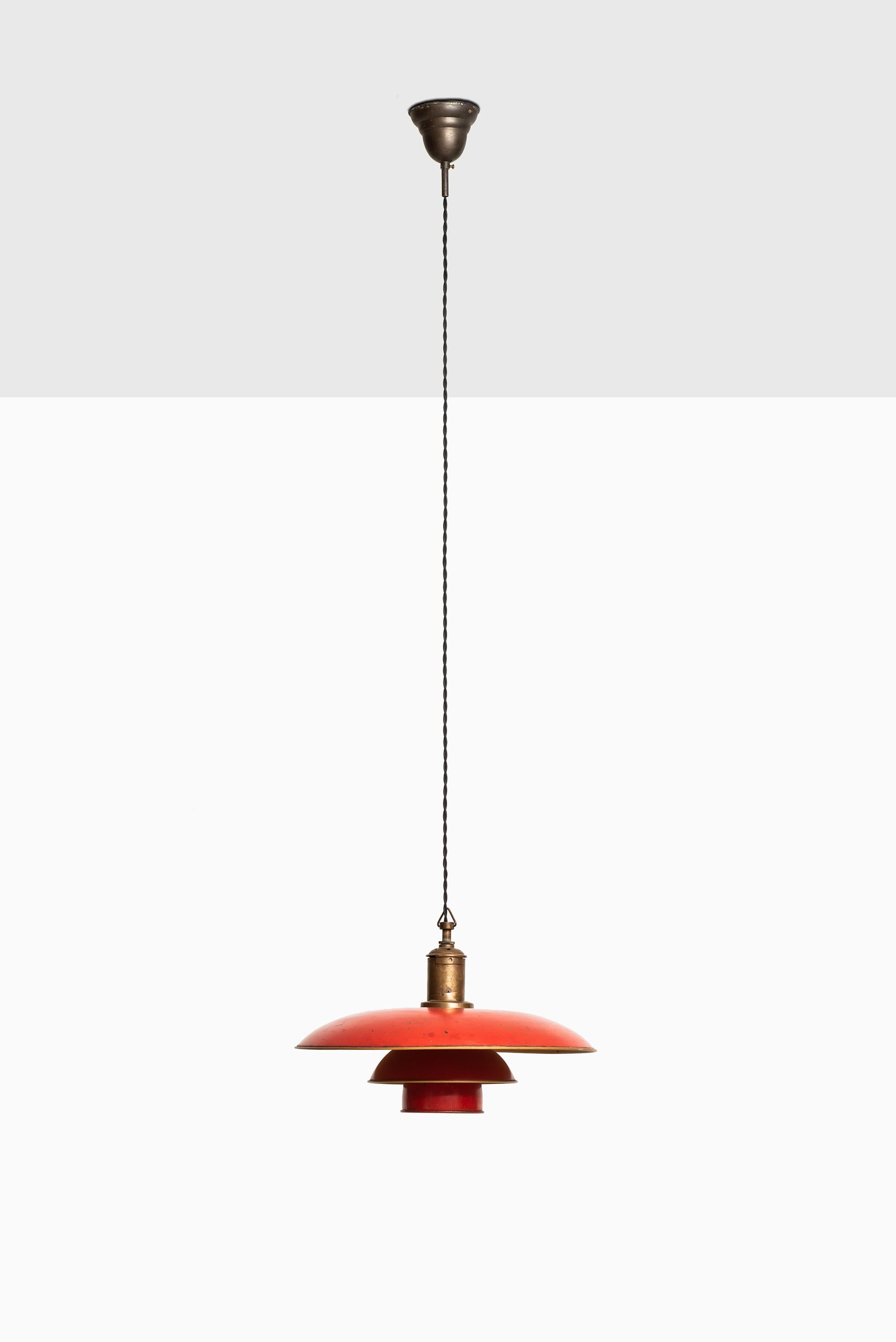 Rare and early ceiling lamp model PH-4/3 designed by Poul Henningsen. Produced by Louis Poulsen in Denmark. Original red/bronzed copper shades. Stamped PAT.APPL.