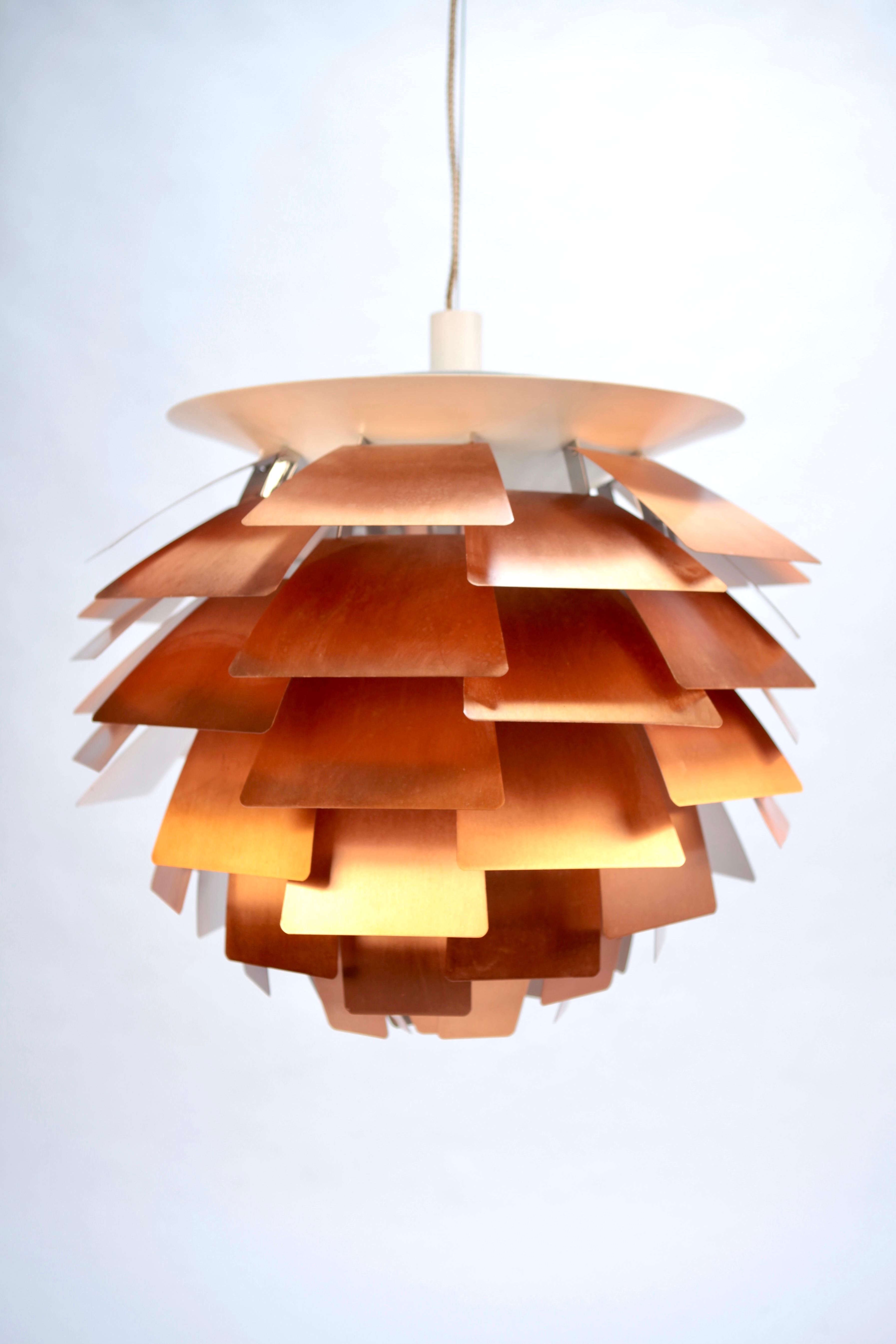 Poul Henningsen, rare 1st. edition 'Artichoke' ceiling light in copper & steel, executed by Louis Poulsen in Denmark in the 1950s.
Excellent vintage condition.
Signed with original paper label.

 