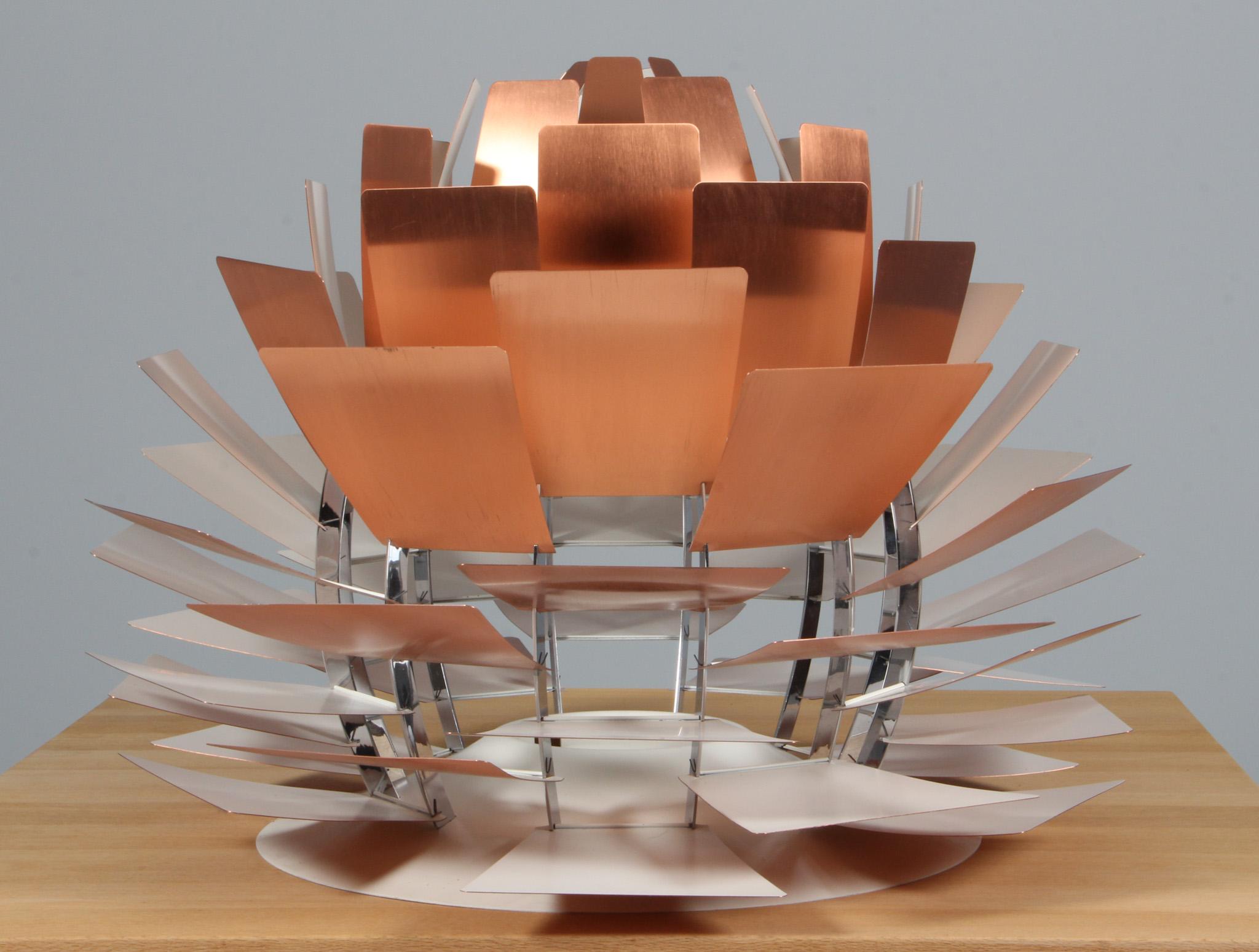 Poul Henningsen for Louis Poulsen, 'PH-Artichoke' pendant, copper, metal, Denmark, designed in 1957

The 'Artichoke' pendant is an all time eyecatcher in the lighting design. This iconic pendant, designed by Poul Henningsen, has copper shades in