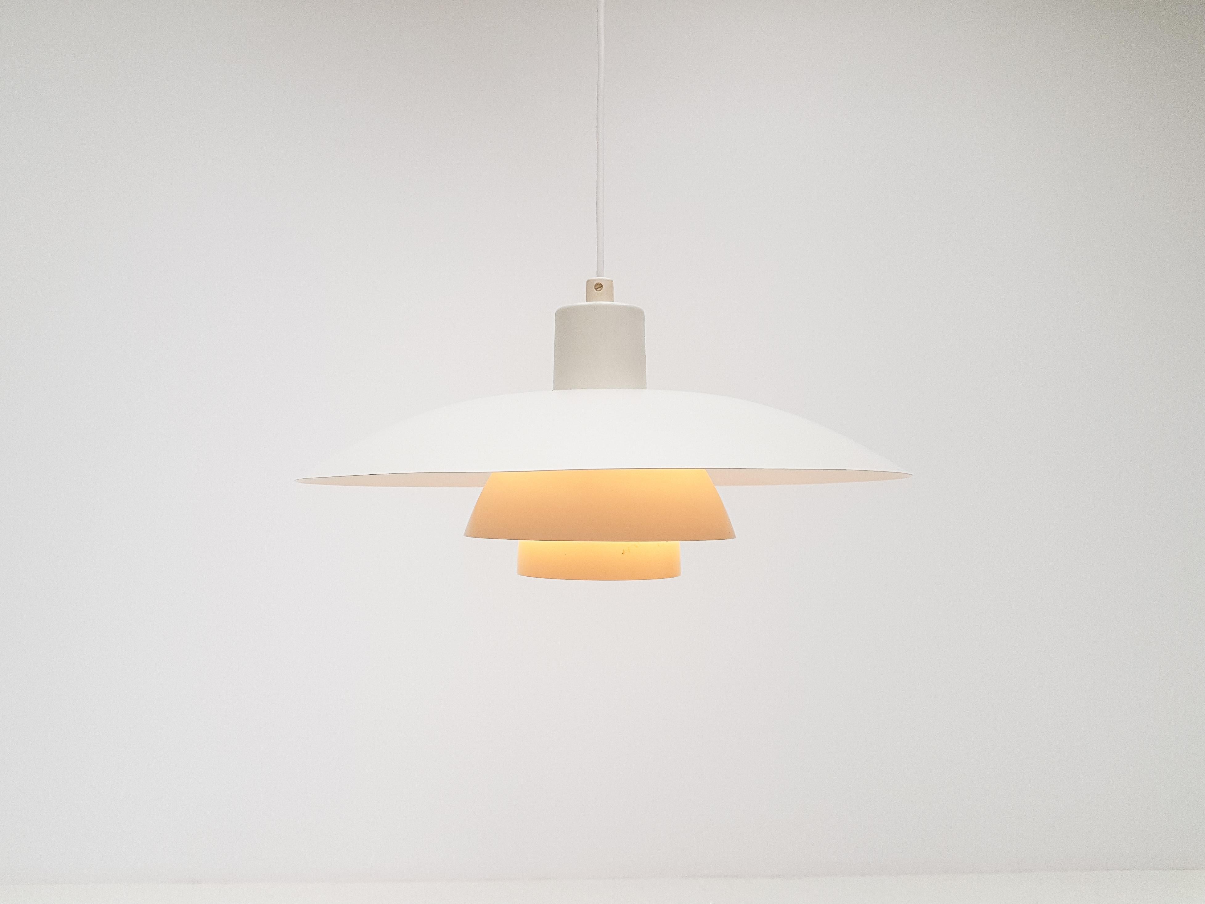 Poul Henningsen for Louis Poulsen PH4 pendant light 

Iconic Poul Henningsen designed Louis Poulsen produced PH4 pendant white lacquered aluminium fixture is designed based on the principle of a reflective three-shade system, which directs light