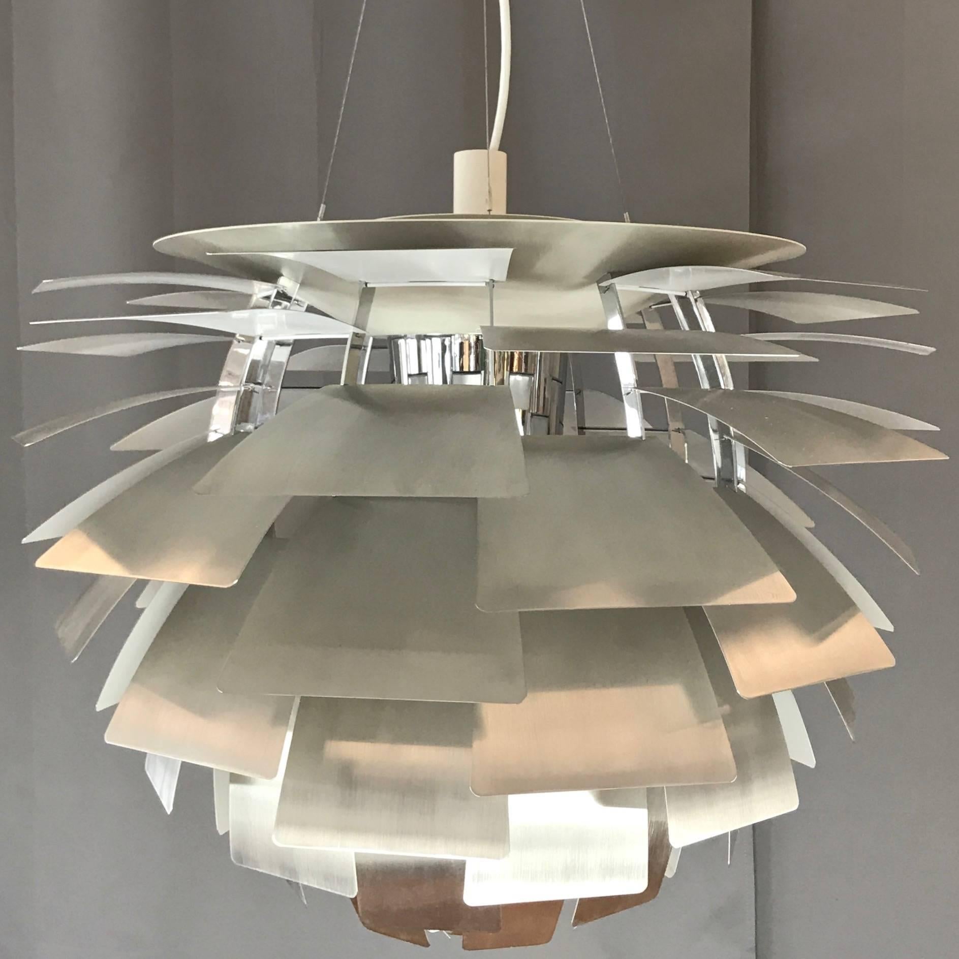 A monumental steel PH Artichoke pendant light by Poul Henningsen for Louis Poulsen in the largest of four sizes produced, which is a less commonly found combination in vintage pieces.

Designed in 1958 for the Langelinie Pavillonen restaurant in
