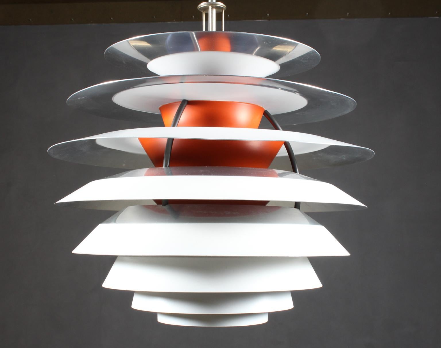 Poul Henningsen pendant with 10 shades each with four different surfaces. Adjustable pendant tube for regulating the contrast lightning.

Made by Louis Poulsen.

Bottom shade missing.