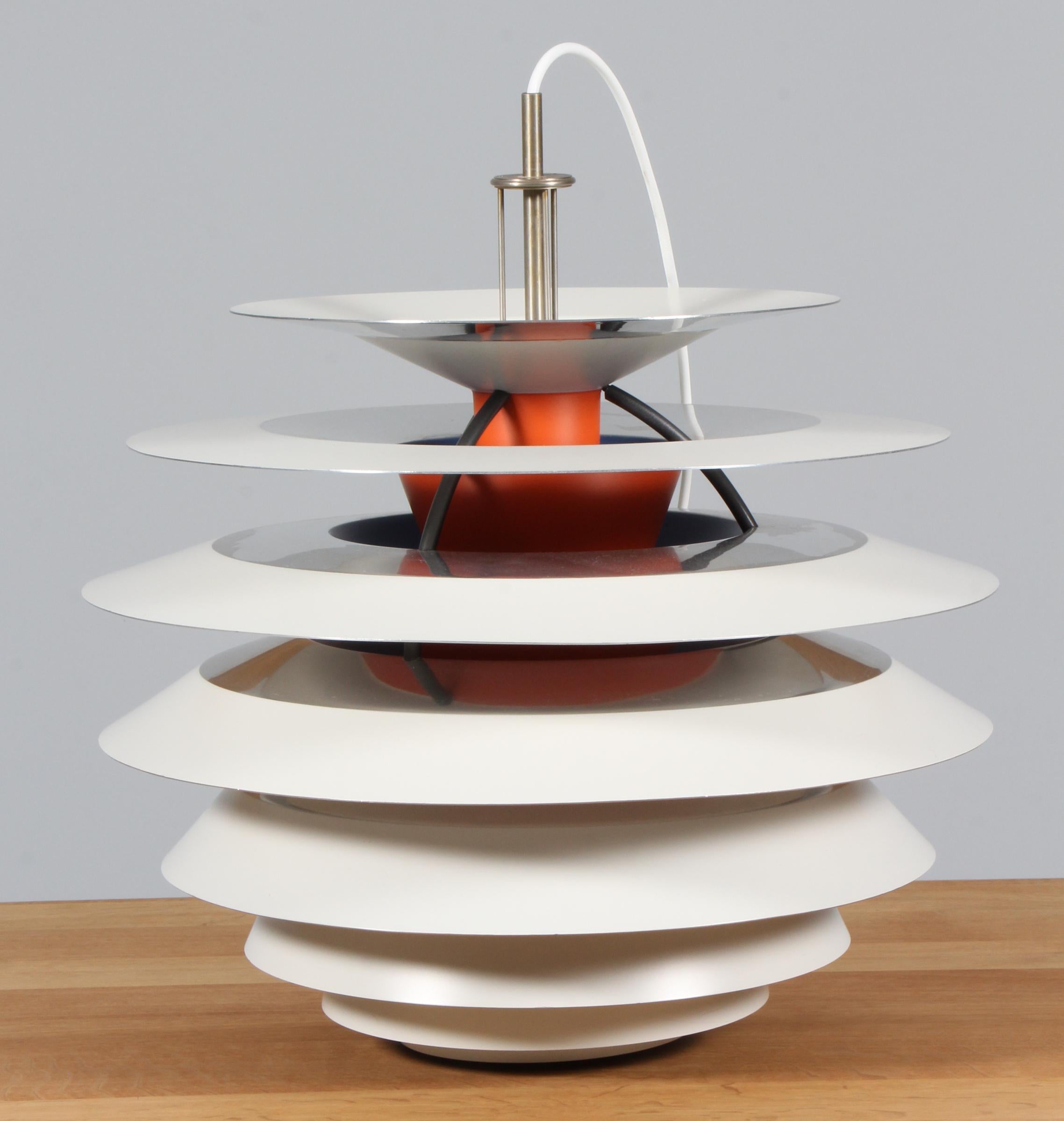 Poul Henningsen pendant with 10 shades each with four different surfaces. Adjustable pendant tube for regulating the contrast lightning.

Made by Louis Poulsen.

Bottom shade missing.