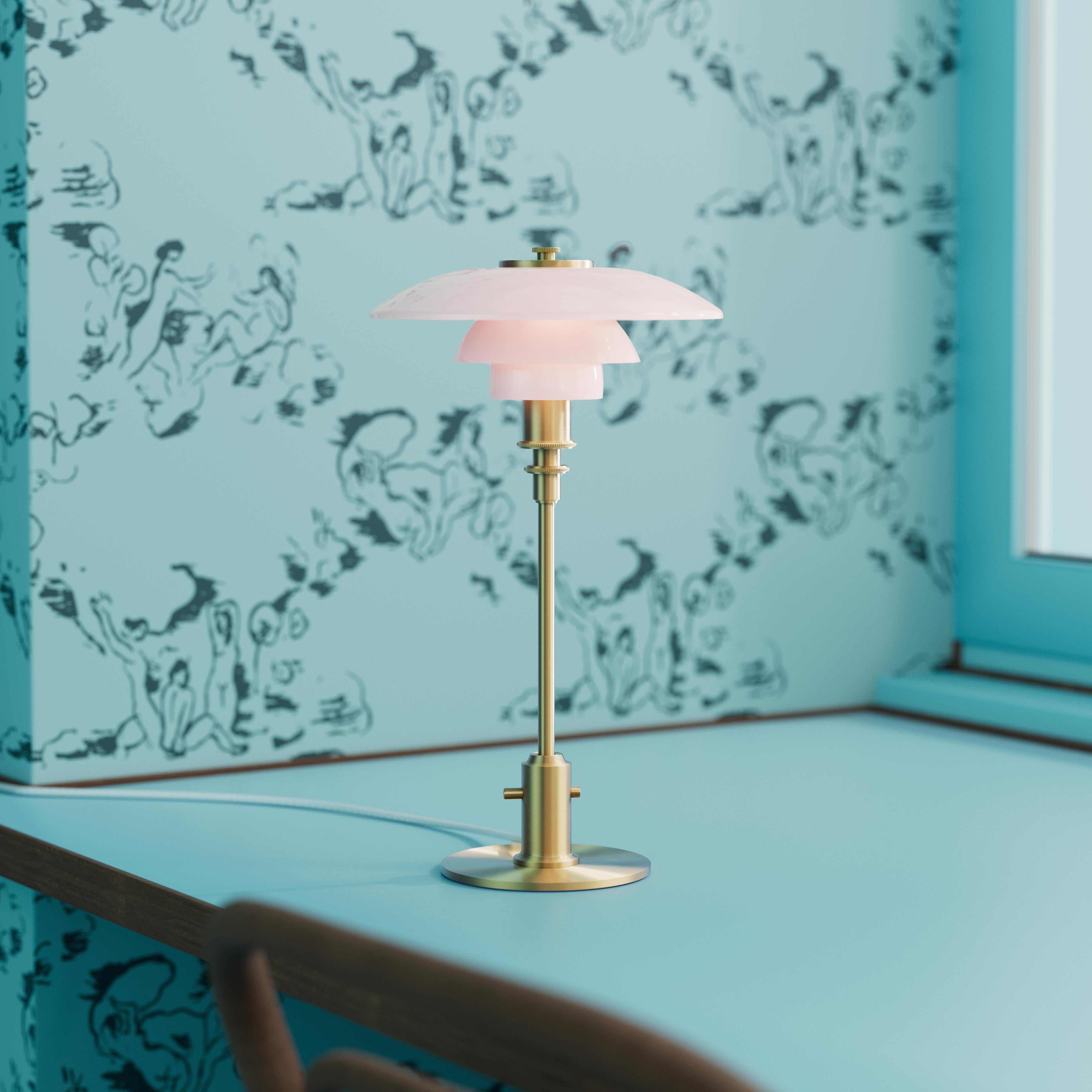 Poul Henningsen PH 2/1 Brass and Glass Table Lamp in Pale Rose for Louis Poulsen

This legendary design stems from Henningsen's brilliant three-shade system from late 1920s, which was later updated with colored glass shades in the 1930s. This