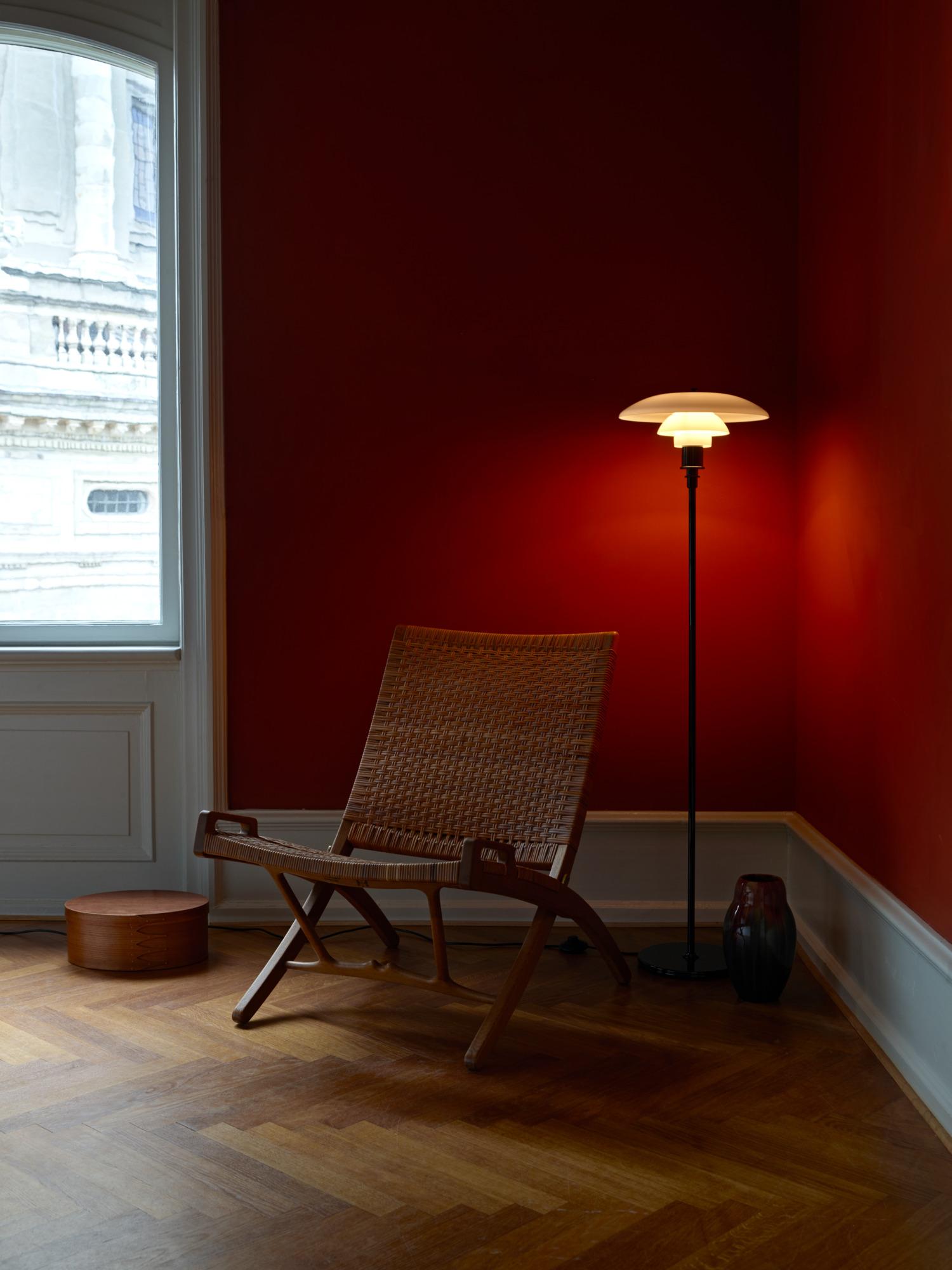 Poul Henningsen PH 3½-2½ opaline glass floor lamp for Louis Poulsen in black. Executed in white opal glass with black metallized frame. The mouth-blown white opal glass shades soften the overall look of the lamp and illuminate its surroundings with