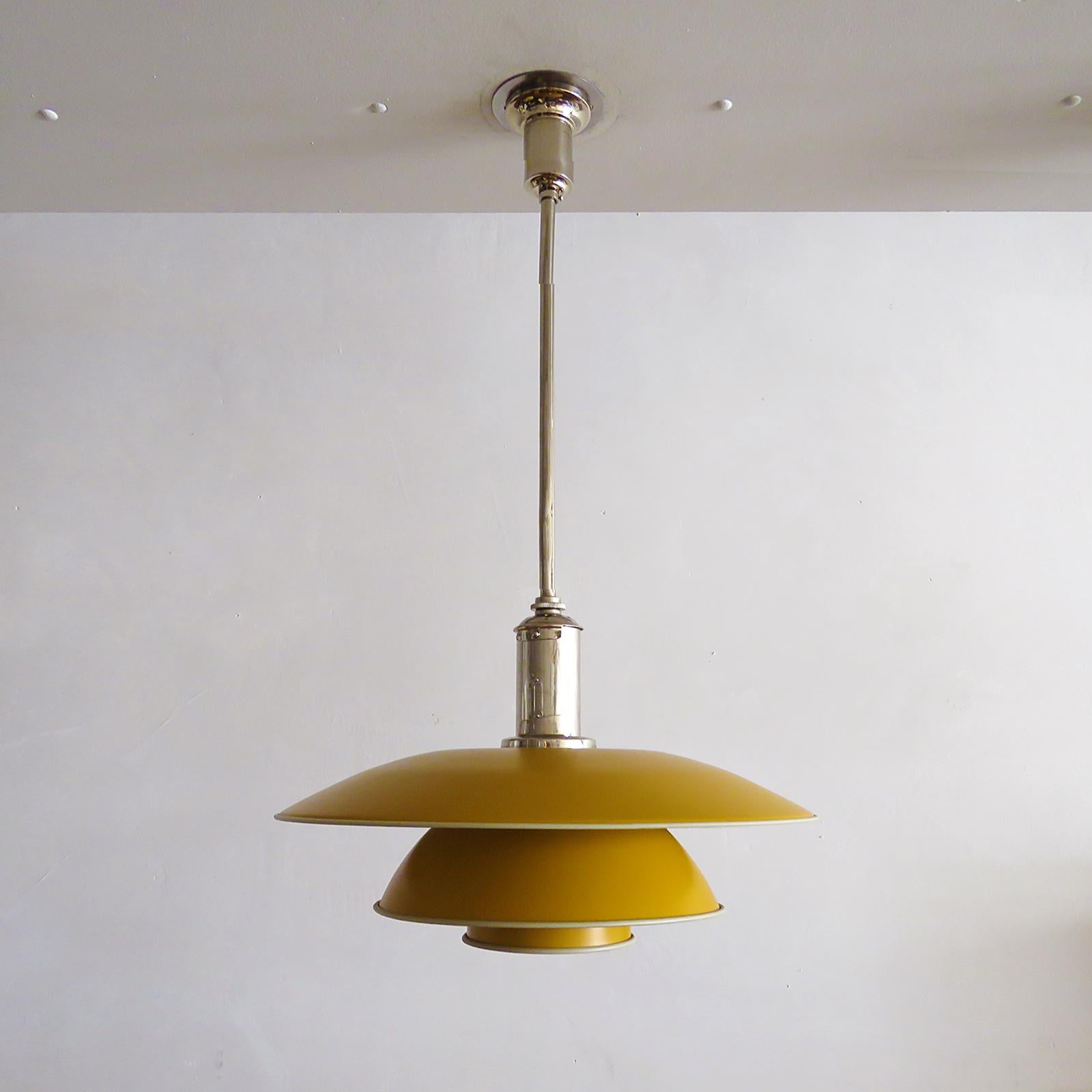 rare 1930s PH-4 pendant light by Poul Henningsen for Louis Poulsen with original shade set, in dark yellow/orange painted metal on an original chrome plated bayonet socket housing, stem and canopy, stamped 'PH-4', 'Patented'.
