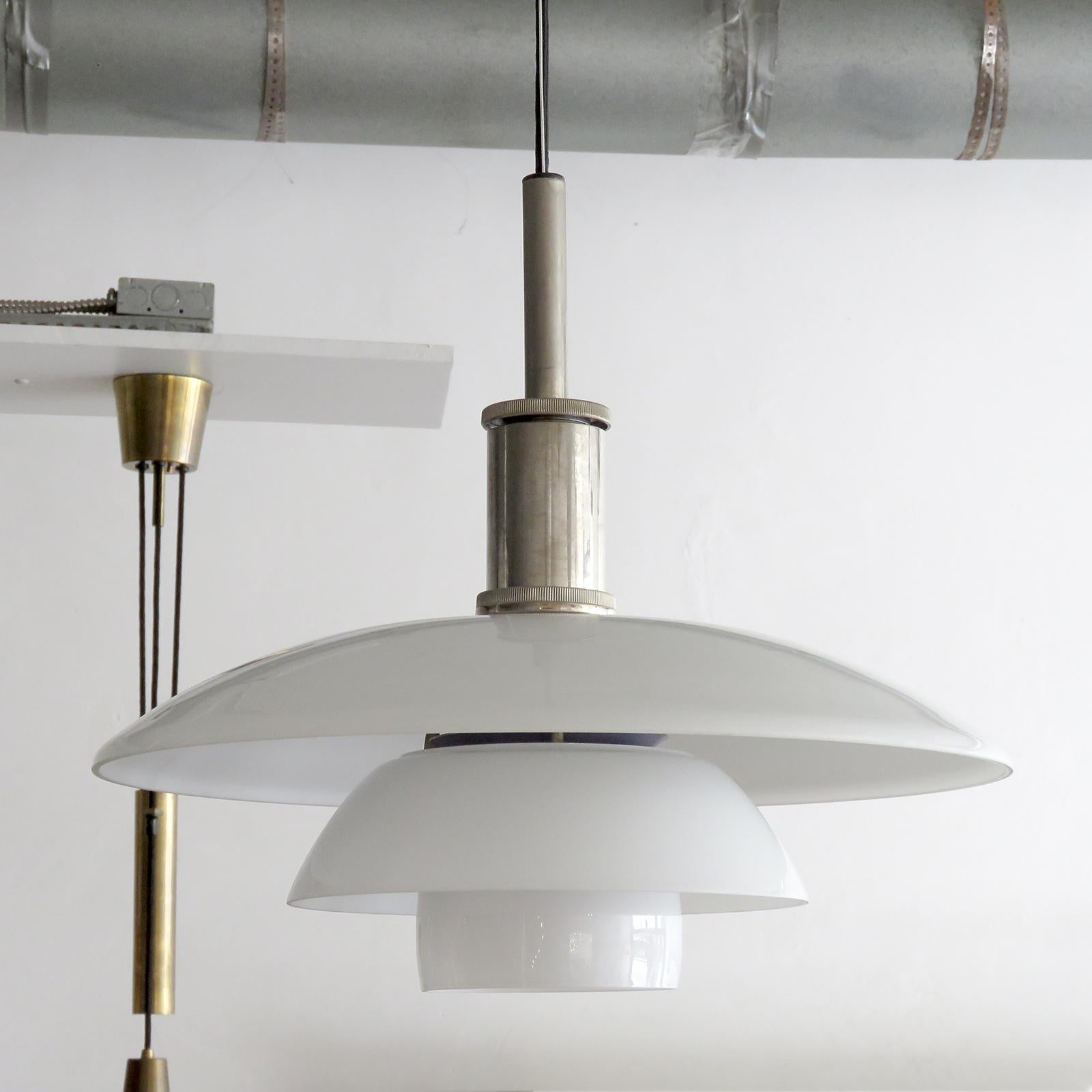 Wonderful PH 4½/4 pendant light by Poul Henningsen for Louis Poulsen with opaline glass shade set, diffuser in matte frosted glass and chrome hardware, marked, wired for US standards, one E27 socket, max. wattage 75w, bulb provided as a onetime