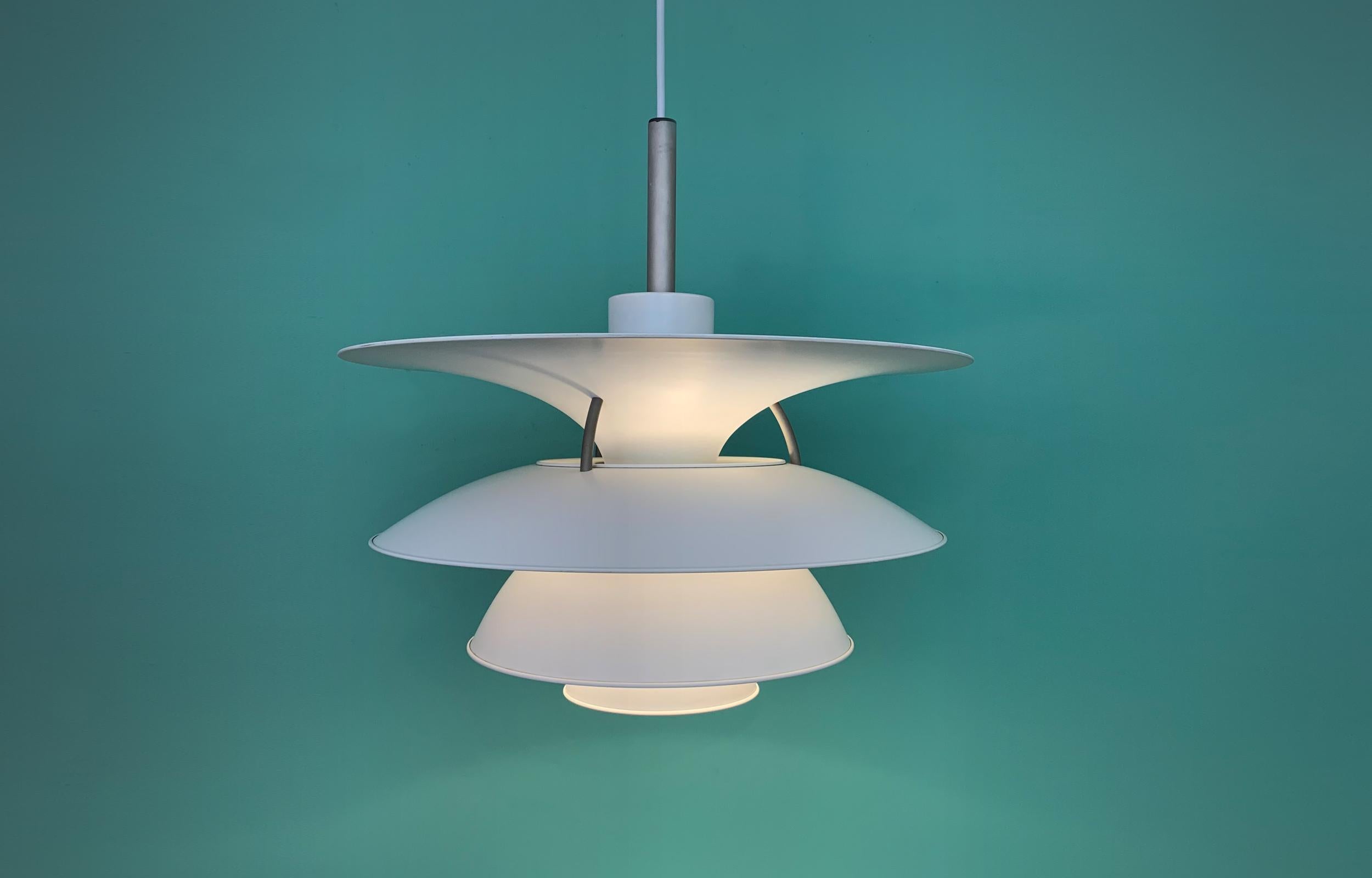 Wonderful pendant lamp designed by Poul Henningsen. Produced by Louis Poulsen Denmark. 
New white 2.5 m fabric cord. 

Mid-Century Modern Classic design.

Perfect original condition with minor wear consistent with age and use.