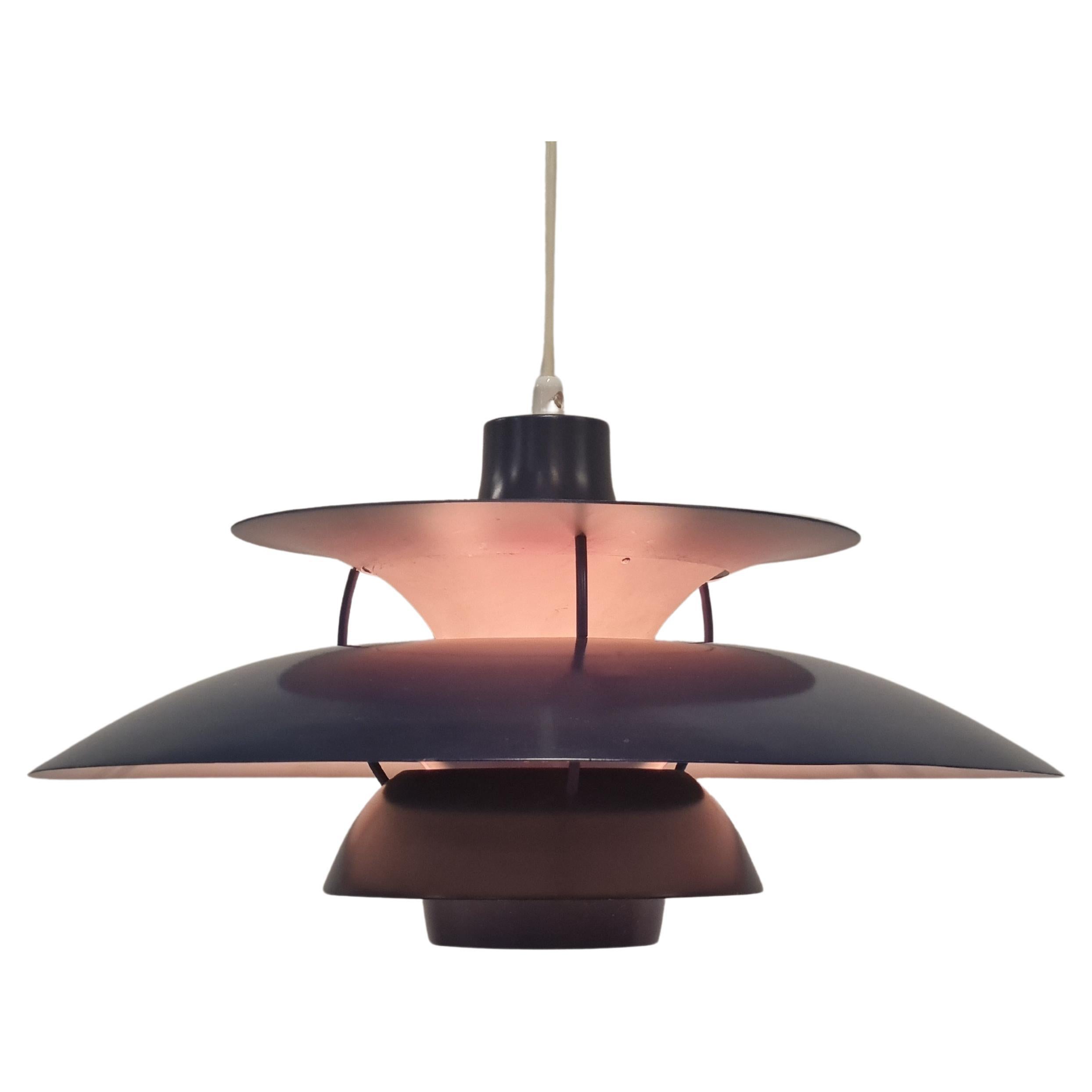 A rare Orno version of the classic PH5 lamp by Poul Henningsen. This dark blue and red pendant was one of the pieces manufactured under license by Orno Stockmann in Finland under model number 61-327 (Orno catalouge 1964), which makes it a