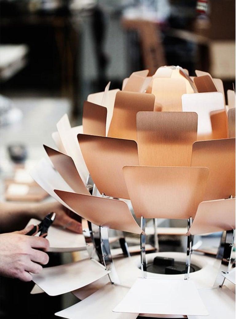 Poul Henningsen 'PH Artichoke' copper chandelier for Louis Poulsen.

The PH Artichoke pendant light was designed in 1958 by Poul Henningsen for the Langelinie Pavillonen restaurant in Copenhagen, where it still hangs today. This iconic lamp has a