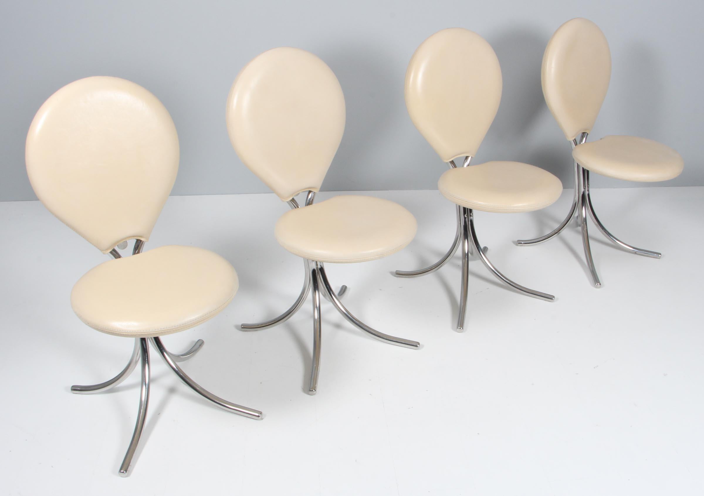 Set of four Poul Hennignsen dining chairs with a frame of tubular chromed steel. Seat and back upholstered with light leather.

Rich details such as Poul Henningsen silhouette on the zipper.

Model PH-507, made by Poul Henningsen A/S.