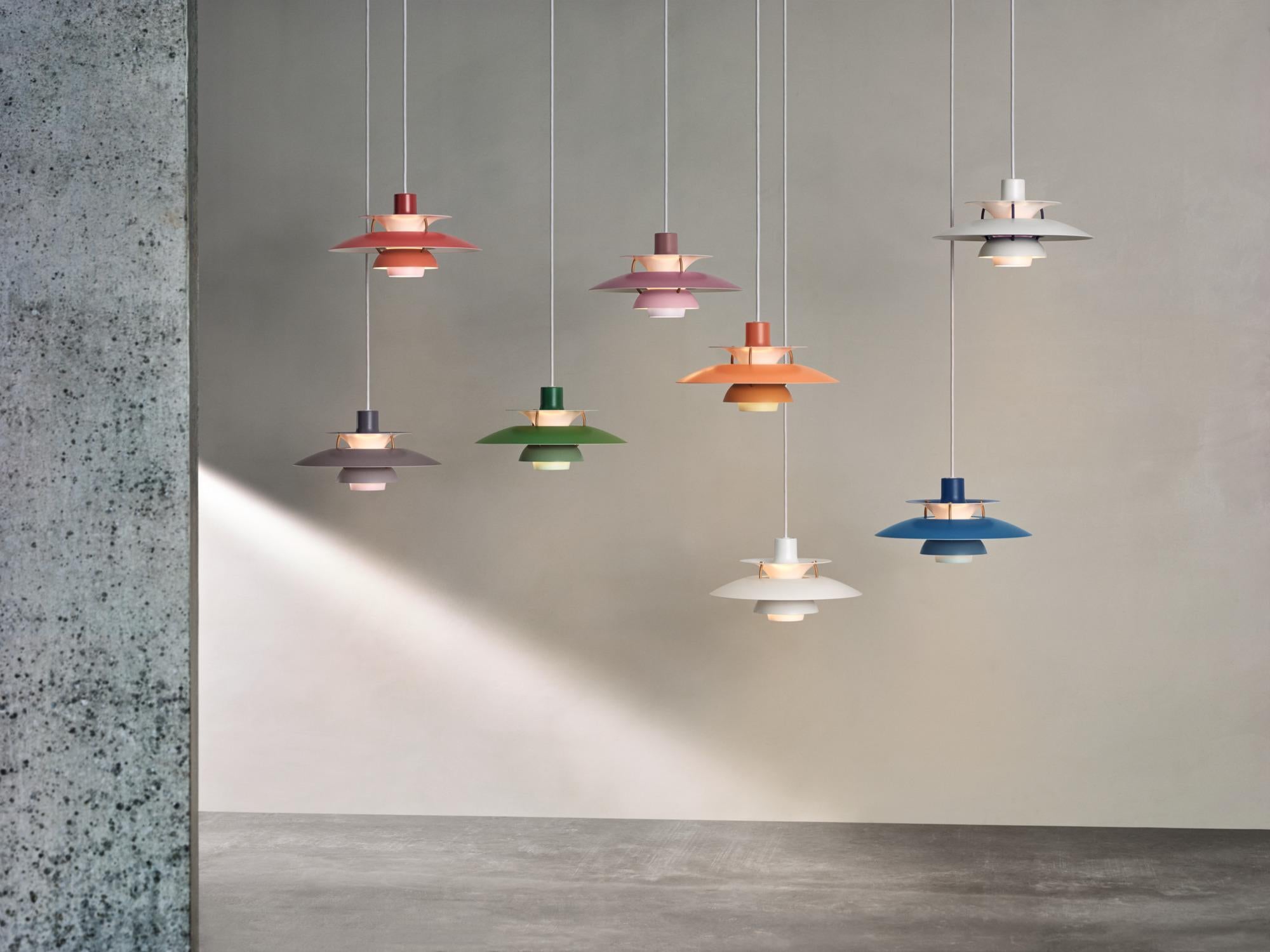 Poul Henningson orange PH5 mini pendant for Louis Poulsen. 

Poul Henningsen originally introduced the full-sized PH 5 pendant light in 1958 as a Classic new product. No one knew at the time that it would eventually become synonymous with the PH
