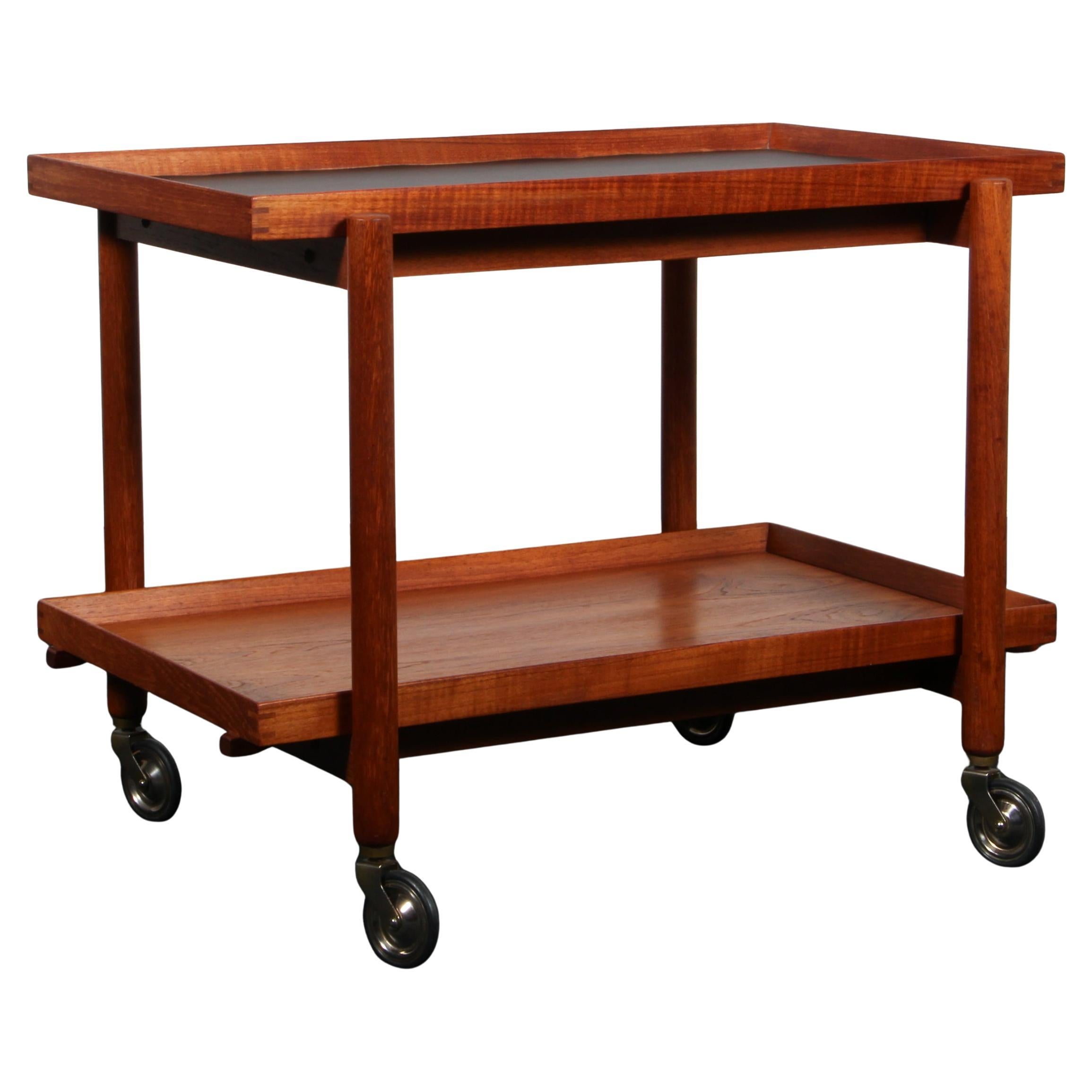 Poul Hundevad bar cart in partly solid teak, 1960
s Denmark. For Sale