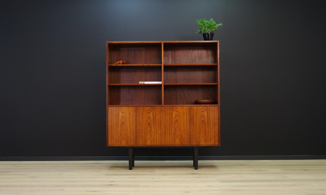 Minimalist cabinet, bookcase from the 1960s-1970s, Danish design. Phenomenal form created by the Danish designer Poul Hundevad, produced in the Hundevad & Co. manufactory. The surface is veneered with a rosewood. Has a key. Adjustable shelves.