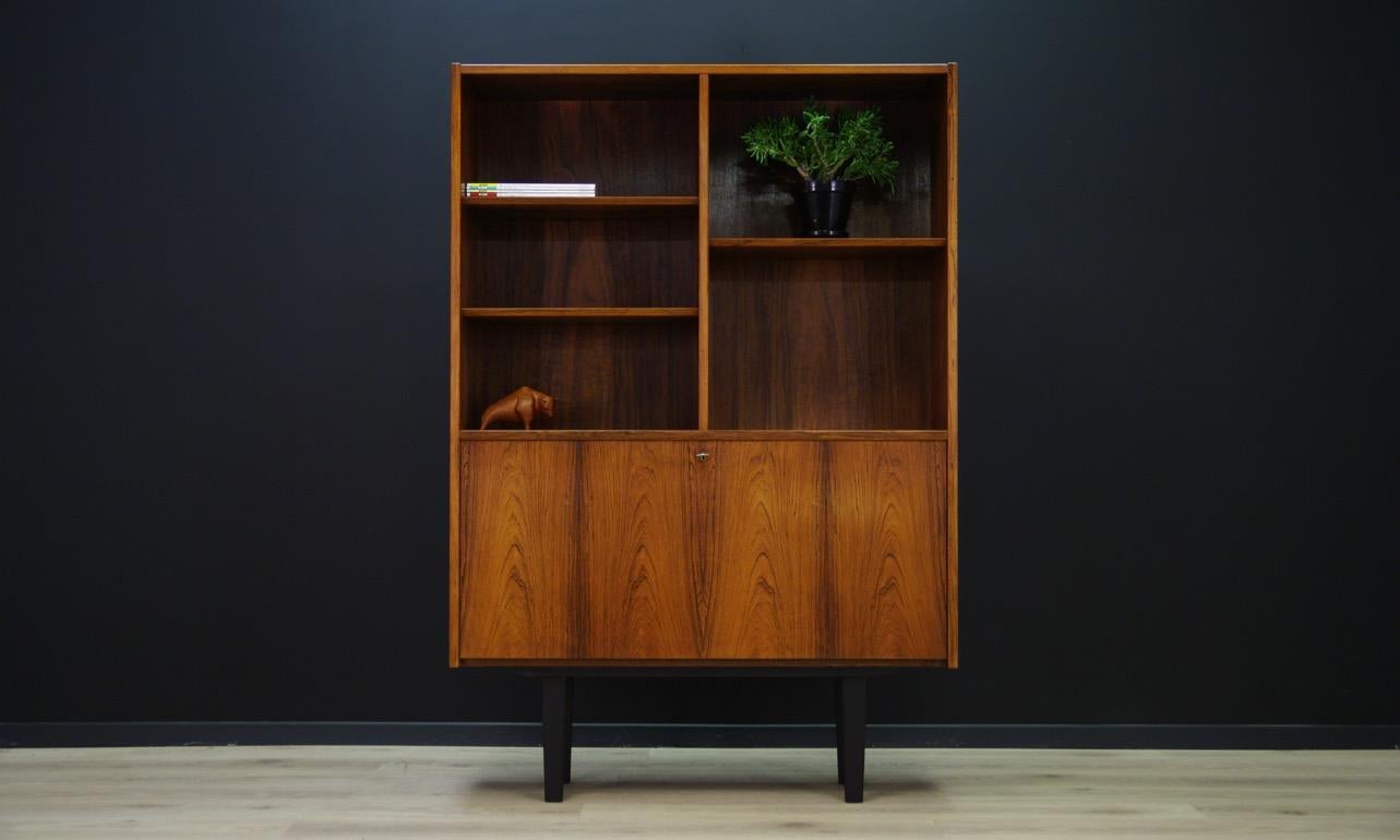 Minimalist bookcase with bar from 1960s-1970s. Danish design, phenomenal form created by designer Poul Hundevad, produced in the Hundevad & Co. manufactory. The surface is veneered with a rosewood. Adjustable shelves. The library has a key.