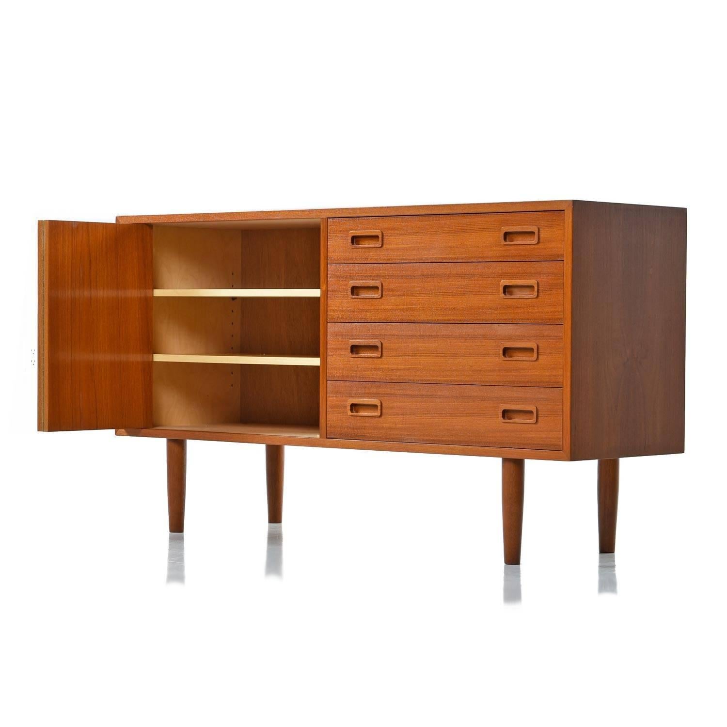Mid-Century Modern teak credenza by Poul Hundevad. Credenza bears the makers mark on the back left corner and is stamped 